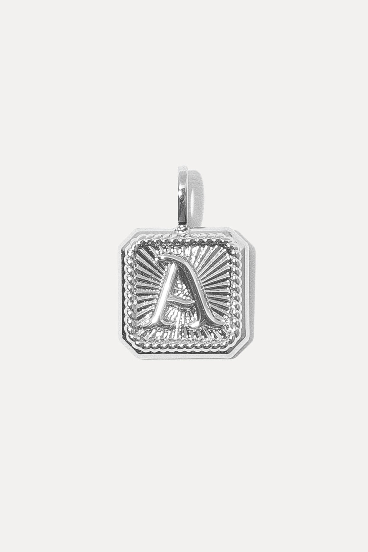 Silver octagonal Alpha Charm with a raised letter "A" and sunburst texture on a white background.