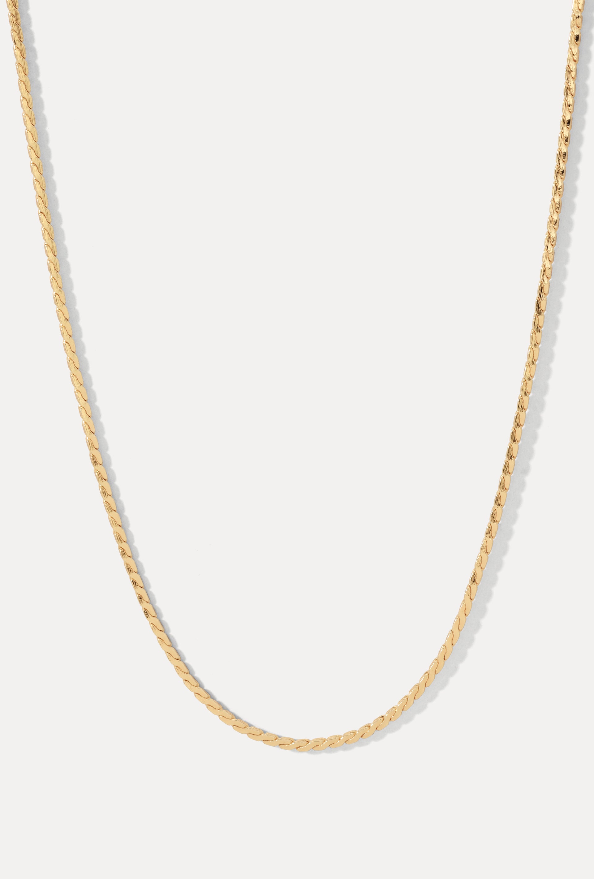 Gold Andee swaged rope chain necklace displayed in a U-shape on a clean white background.