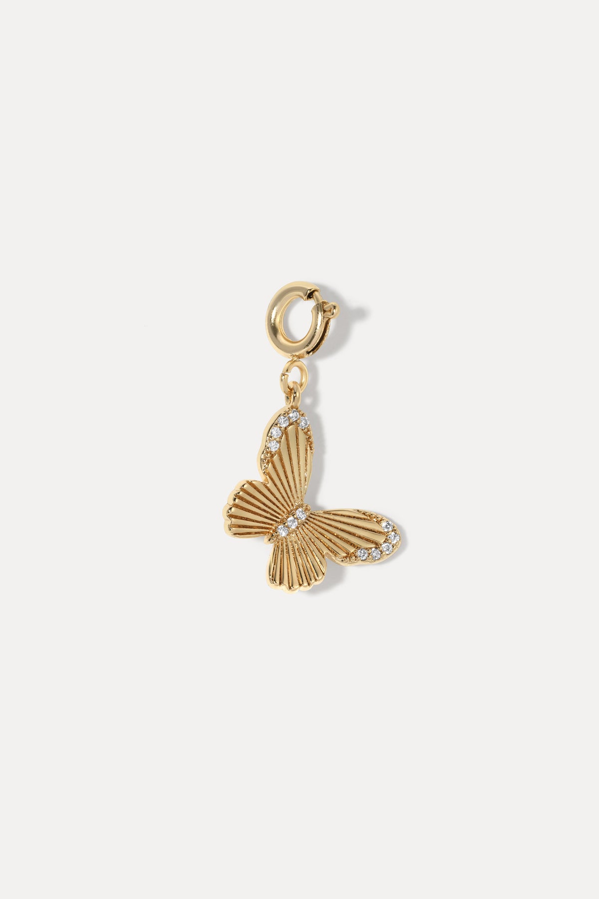 Gold Butterfly Clip On Charm featuring textured wings and cubic zirconia accents on a white background.