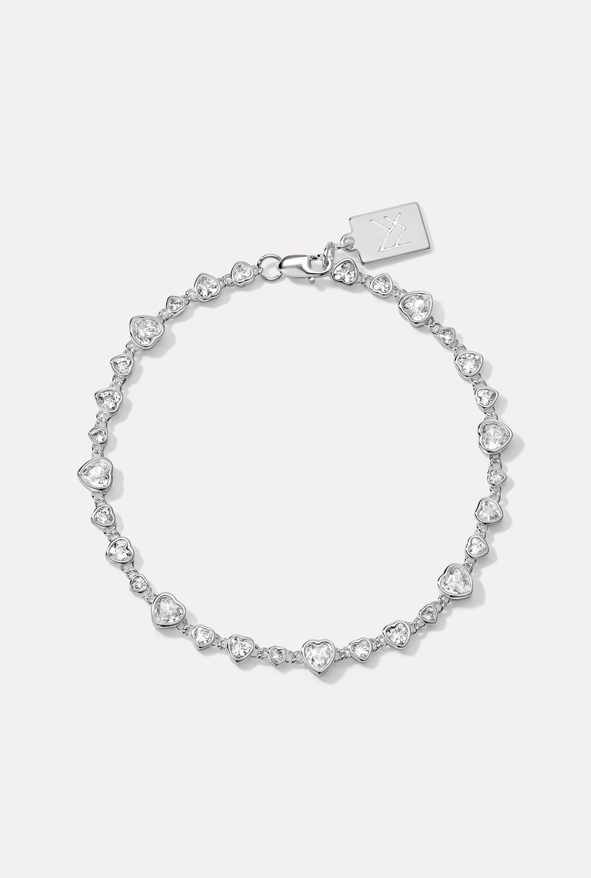 Sterling silver Cora Bracelet displayed in a circle on a white background, showing its heart-shaped CZ settings.
