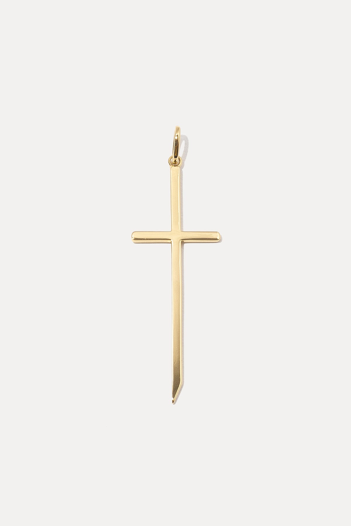 Gold Cross Charm with sleek, elongated lines and an open bail on a white background.