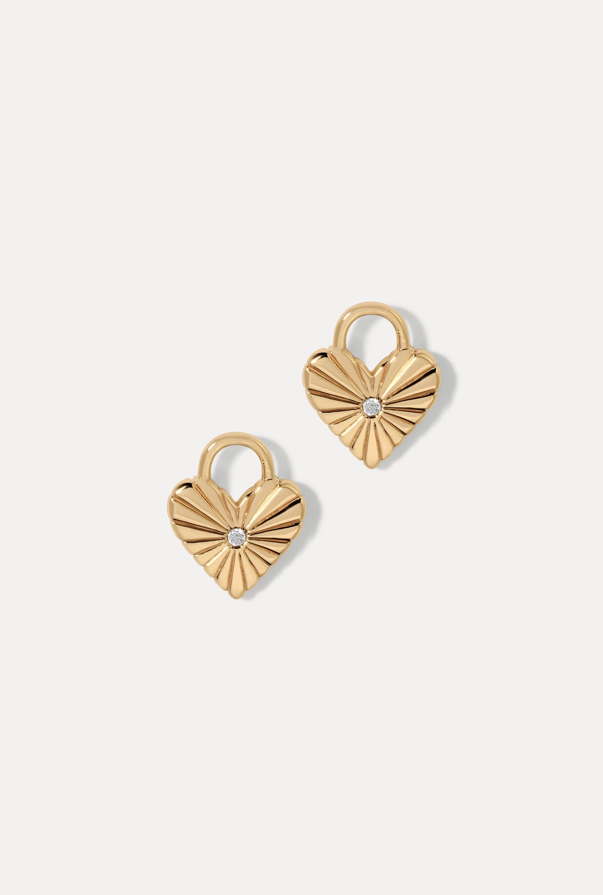 Gold Eleanor heart-shaped earring charms with textured grooves and CZ center stone.