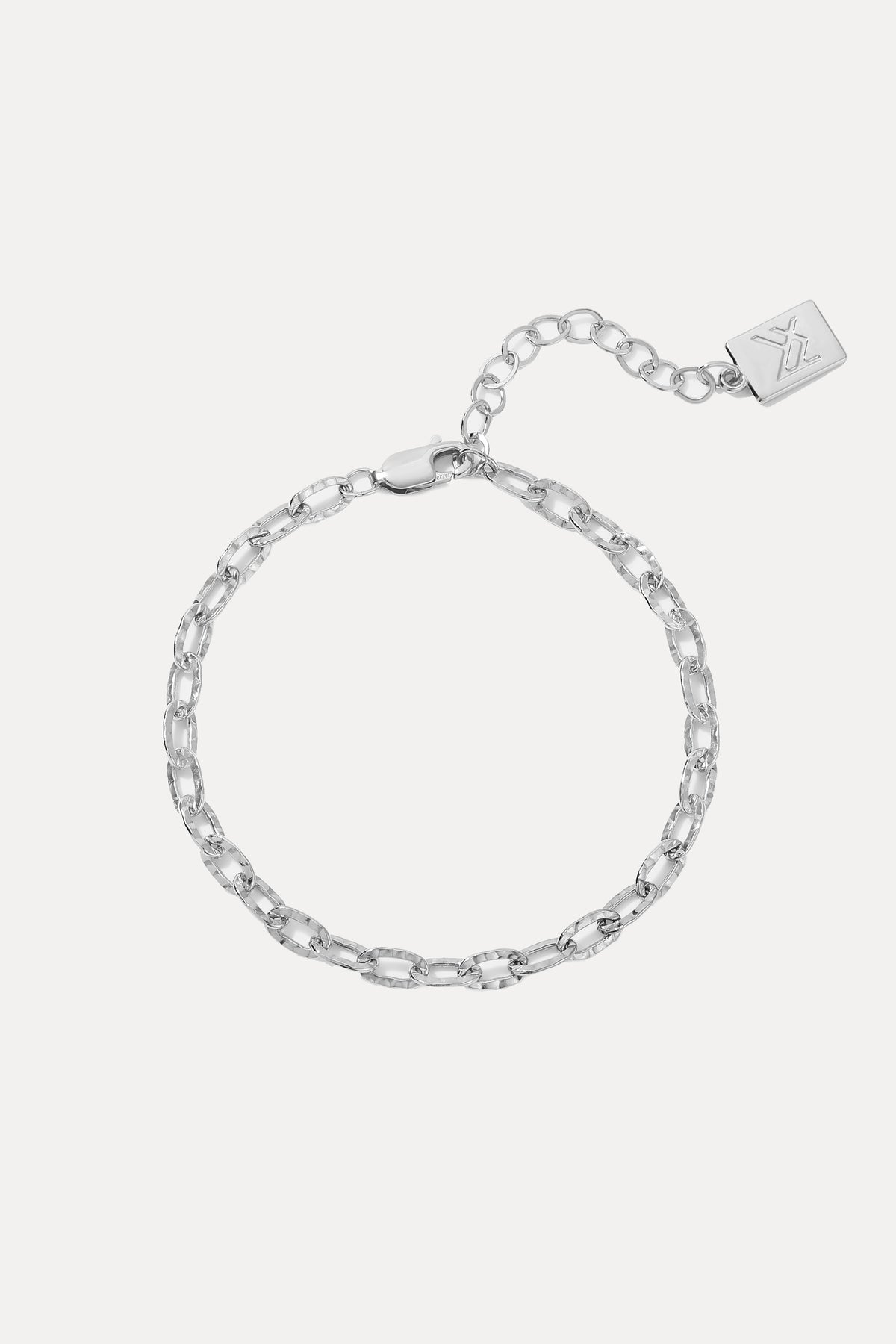 Sterling Silver Emily Bracelet displayed on a white background, showing its hammered chain links, extender, and logo tag.