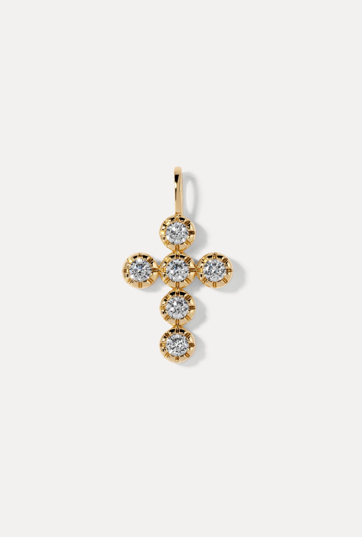 Gold Eternal Charm in a cross shape embellished with round cubic zirconia stones on a white background.