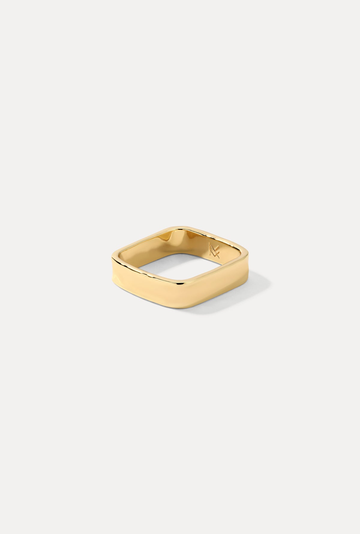 Gold Mae ring featuring a delicate band and polished finish, centered on a plain white background.