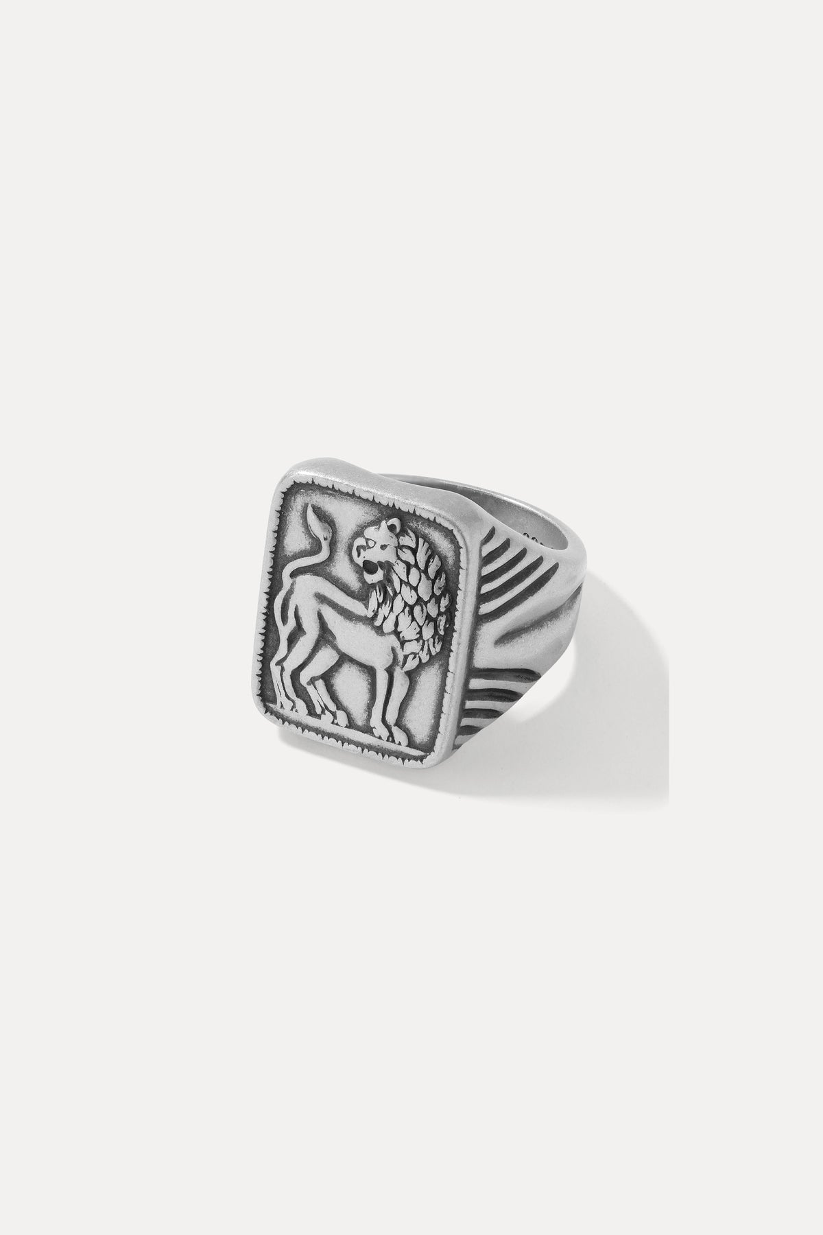 Studio product shot of the sterling silver Judah signet ring with a starburst-set black gem, on a white background.