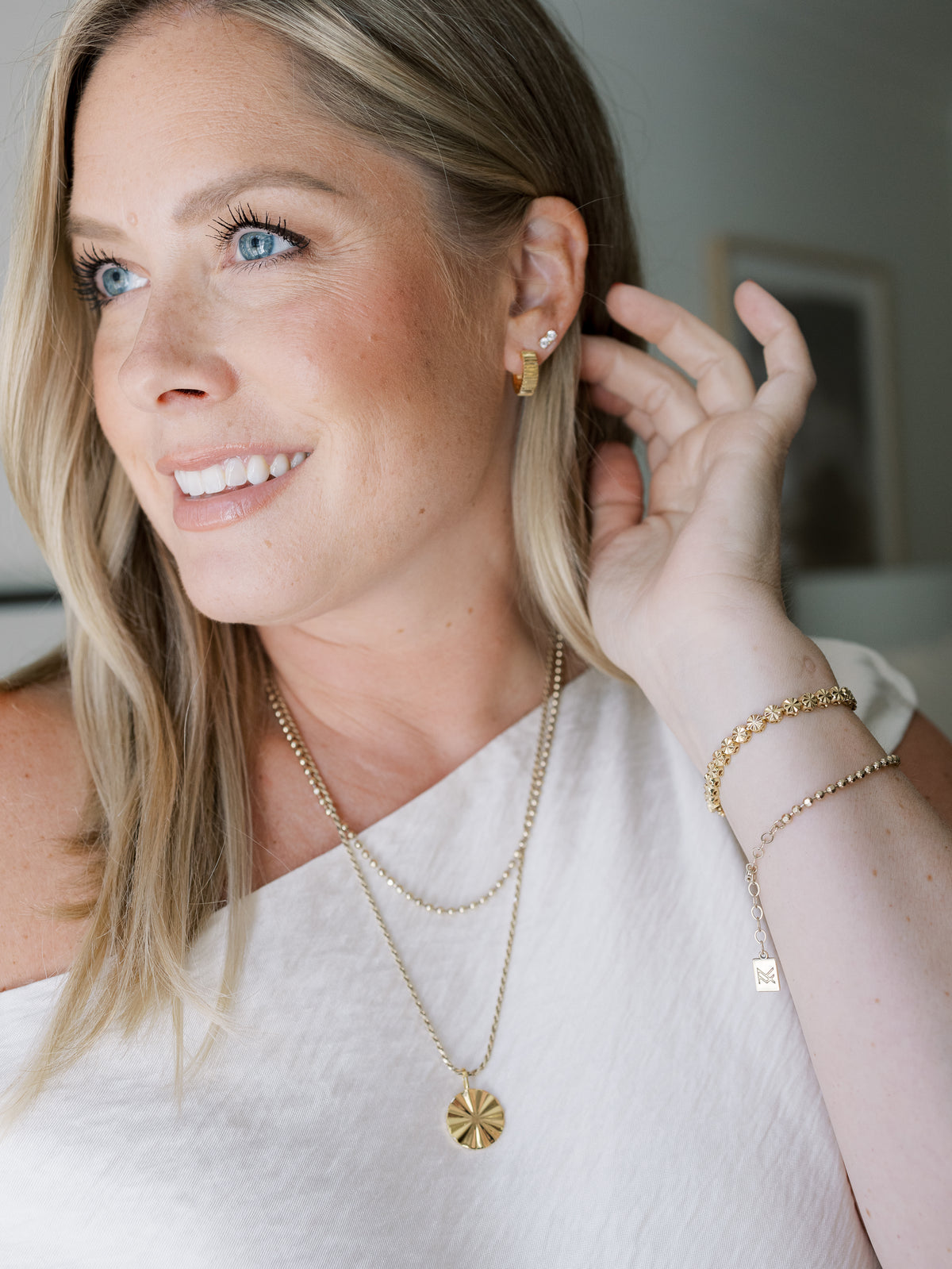 Influencer Kate Bryan wearing the gold Debbie Huggies/