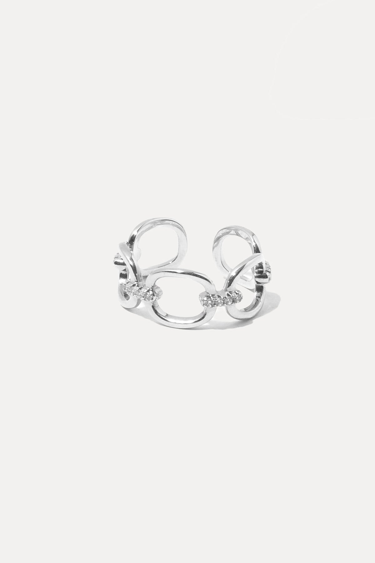 Silver Kennedy ring featuring a delicate band and polished finish, centered on a plain white background.