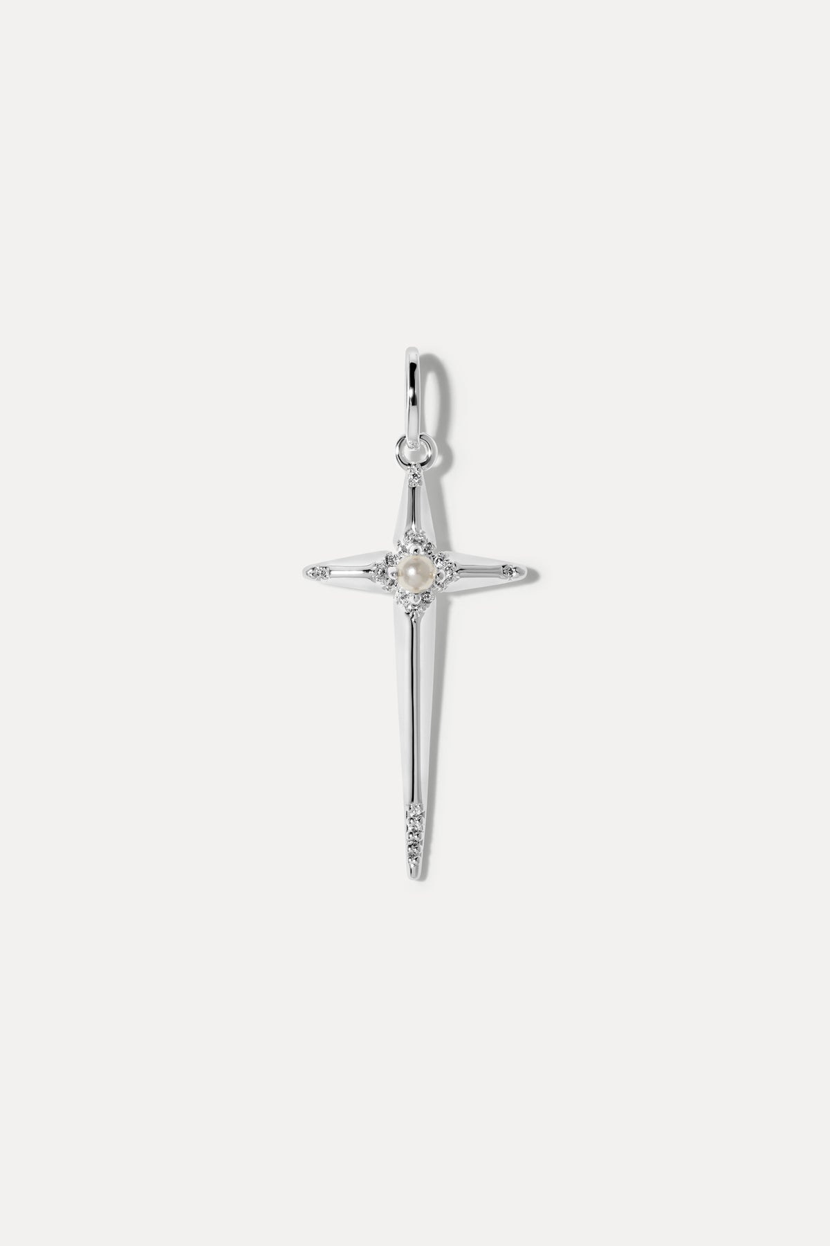 Silver cross charm set with a center pearl and cubic zirconia accents on a bail.