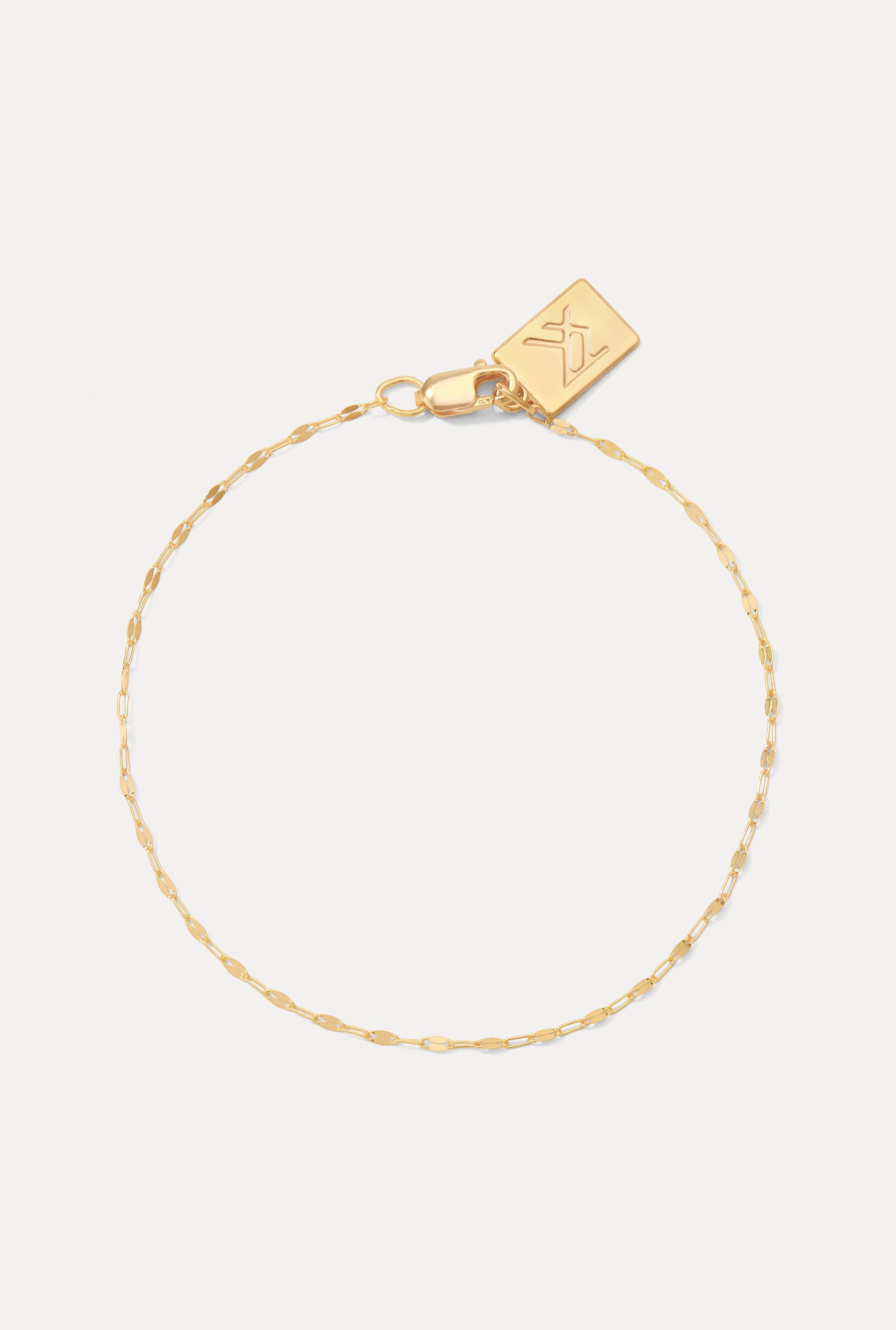 Gold-filled Nora sequin chain bracelet displayed in a circle on a white background with logo tag.