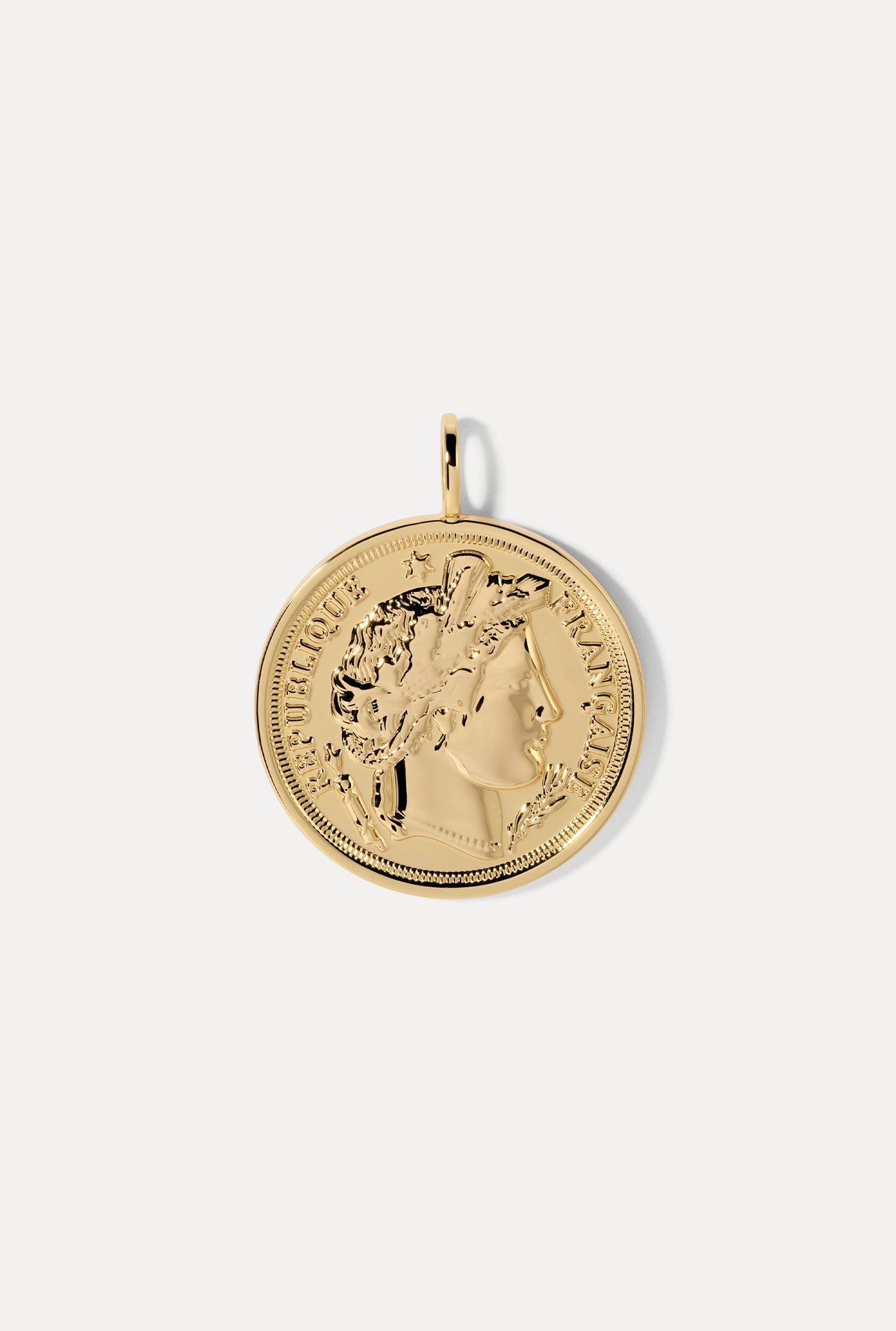 Round vintage-style gold French coin charm on a bail against a plain white background.