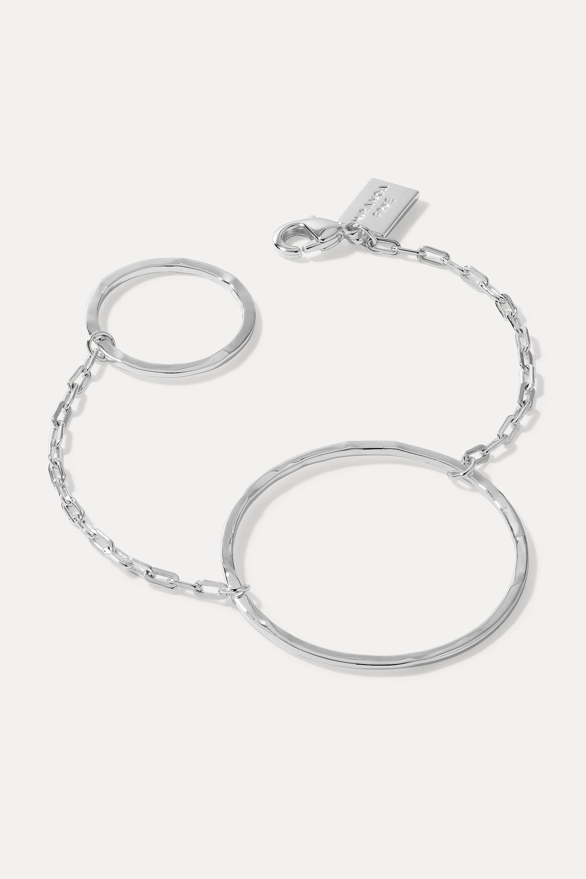 Silver Quinn circle link bracelet with clasp and logo tag displayed on a plain white background.