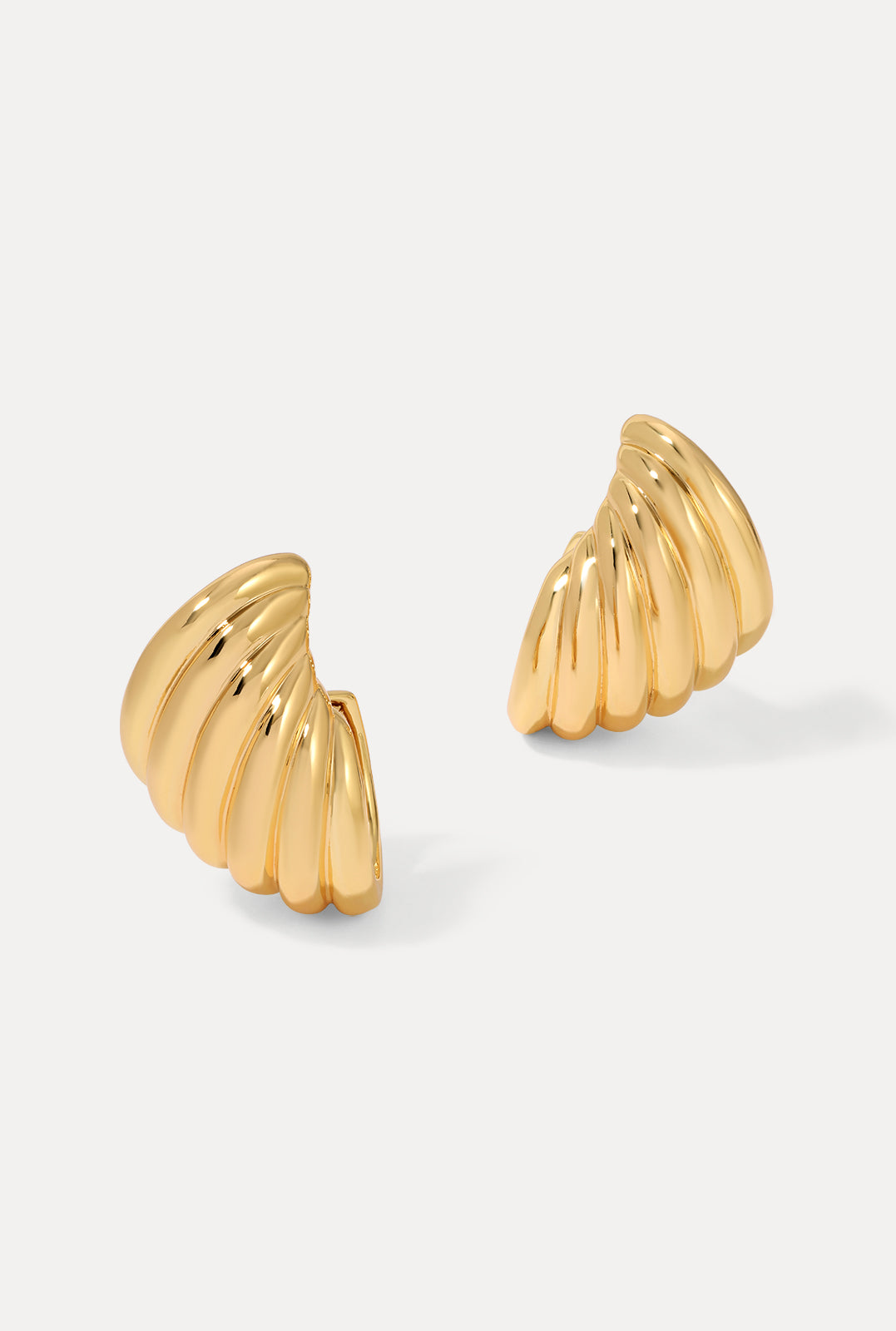 Pair of gold Sirena Earrings featuring a ridged, shell-inspired dome shape on a white background.