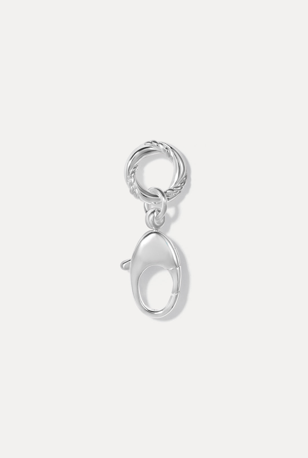 The Sutton Charm in silver pictured on a white background.