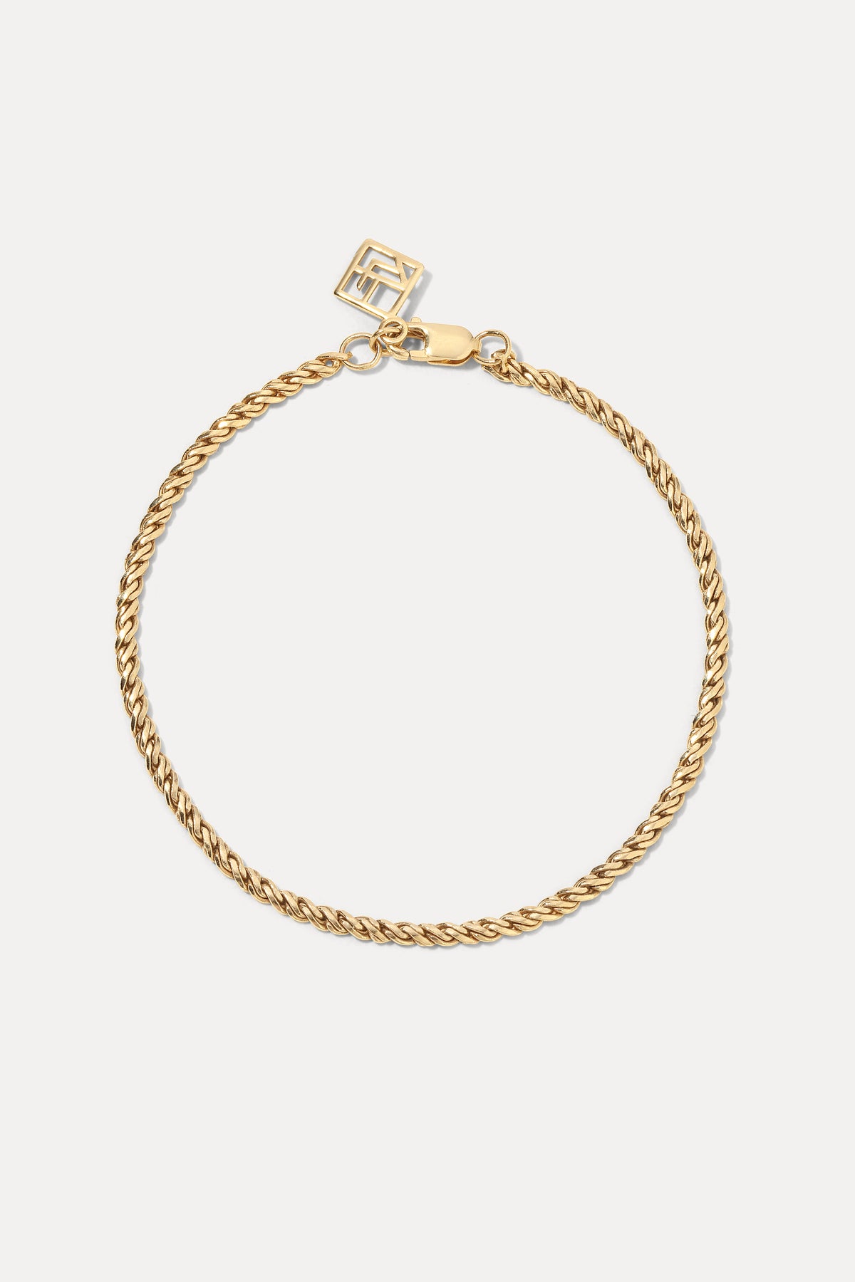 Image of the 14K gold swedged rope chain bracelet displayed laid flat against a plain white background.