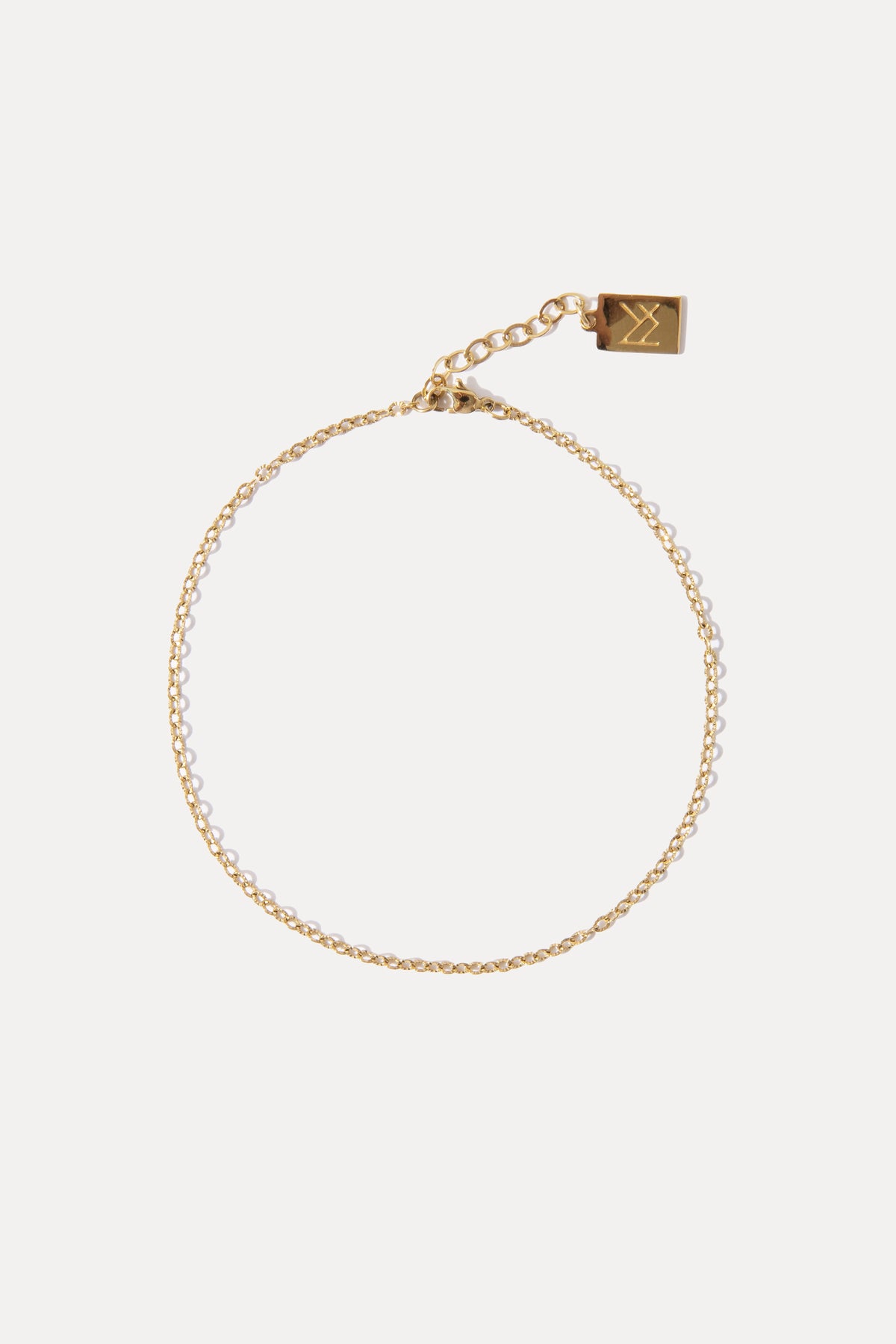 Gold textured chain anklet displayed against a plain white background.