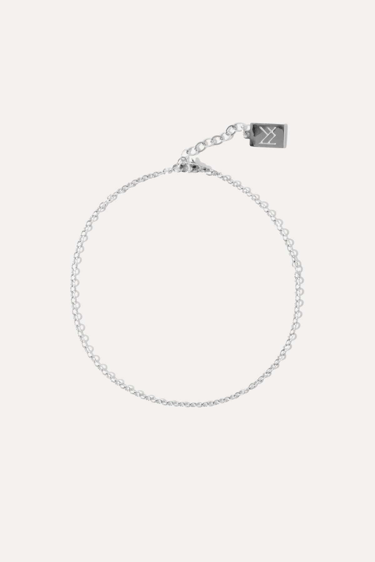 Silver textured chain anklet displayed against a plain white background.
