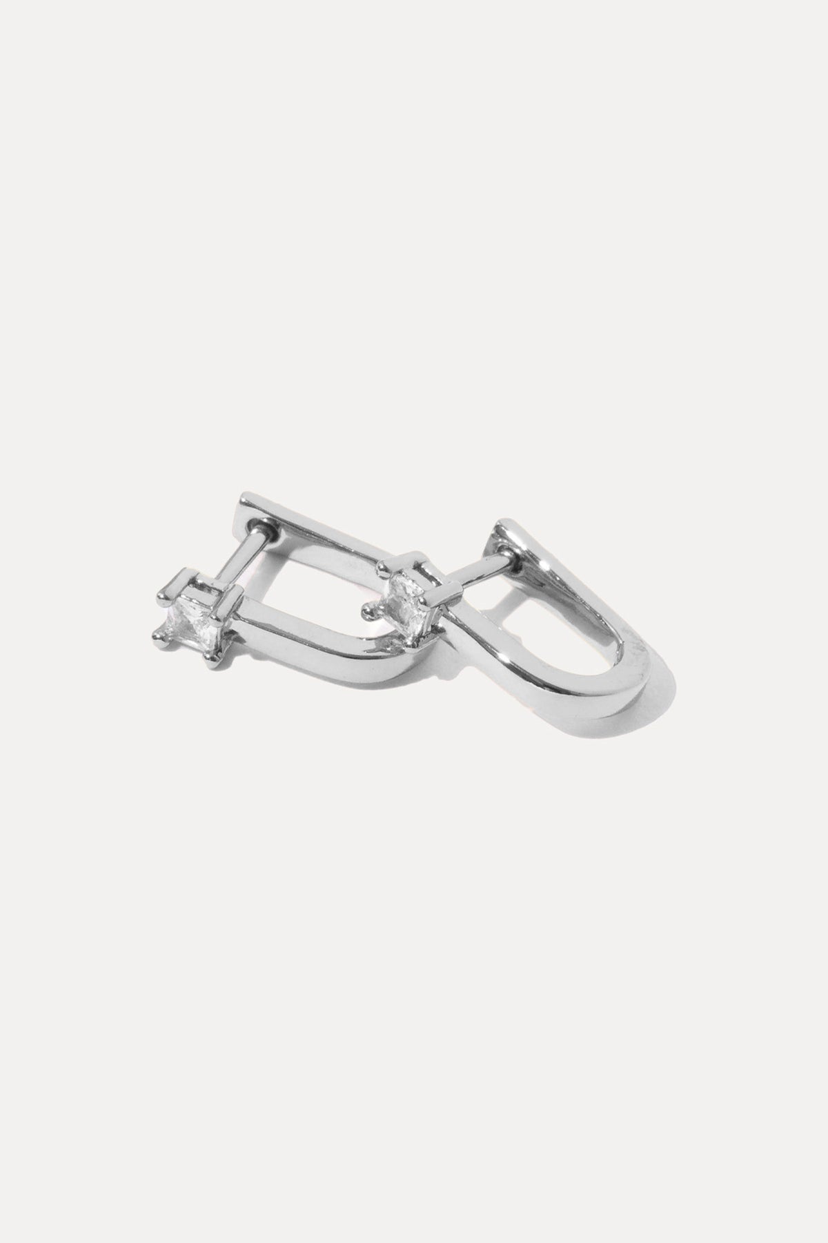 Pair of silver Valentina Huggies with clear cubic zirconia dangles on a clean white background.
