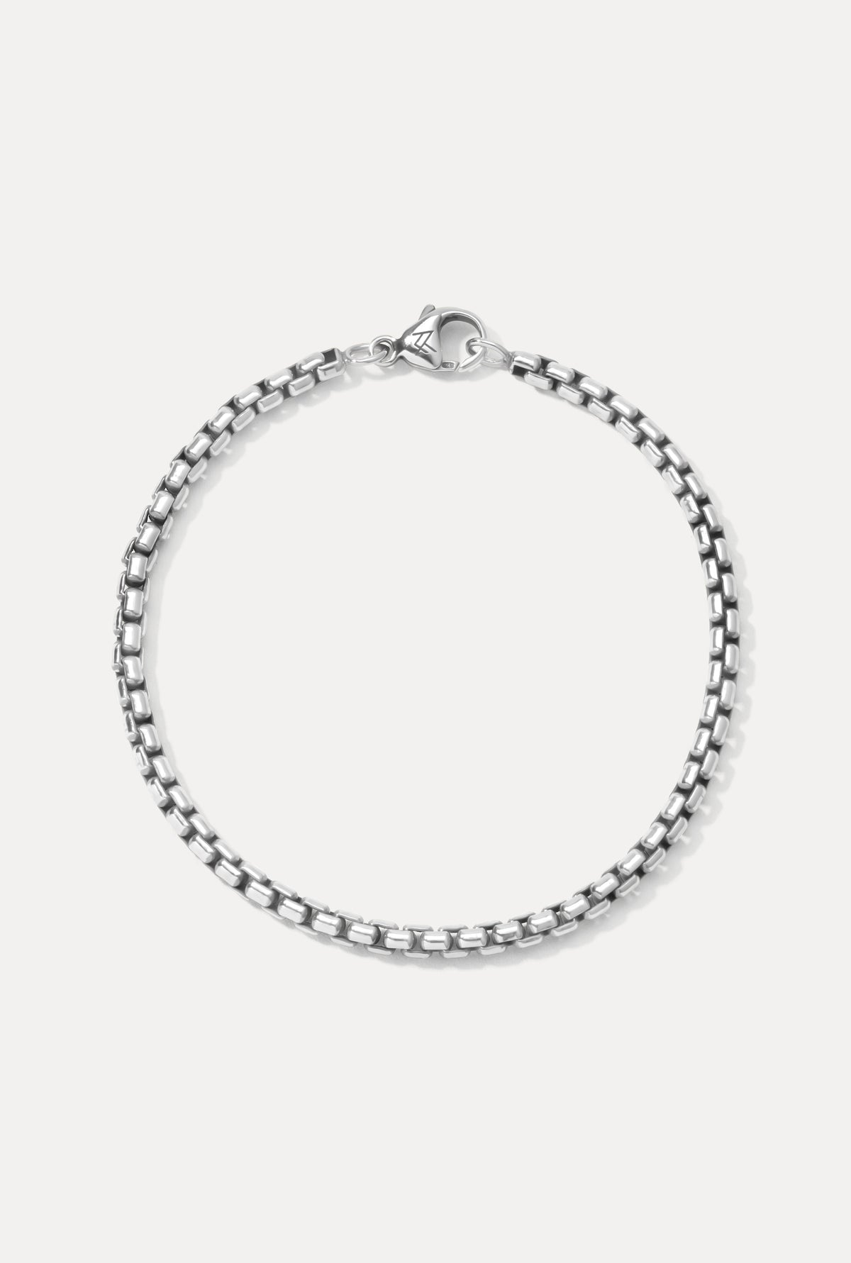 Studio product shot of the sterling silver Wellon bracelet laid flat on a clean white background.