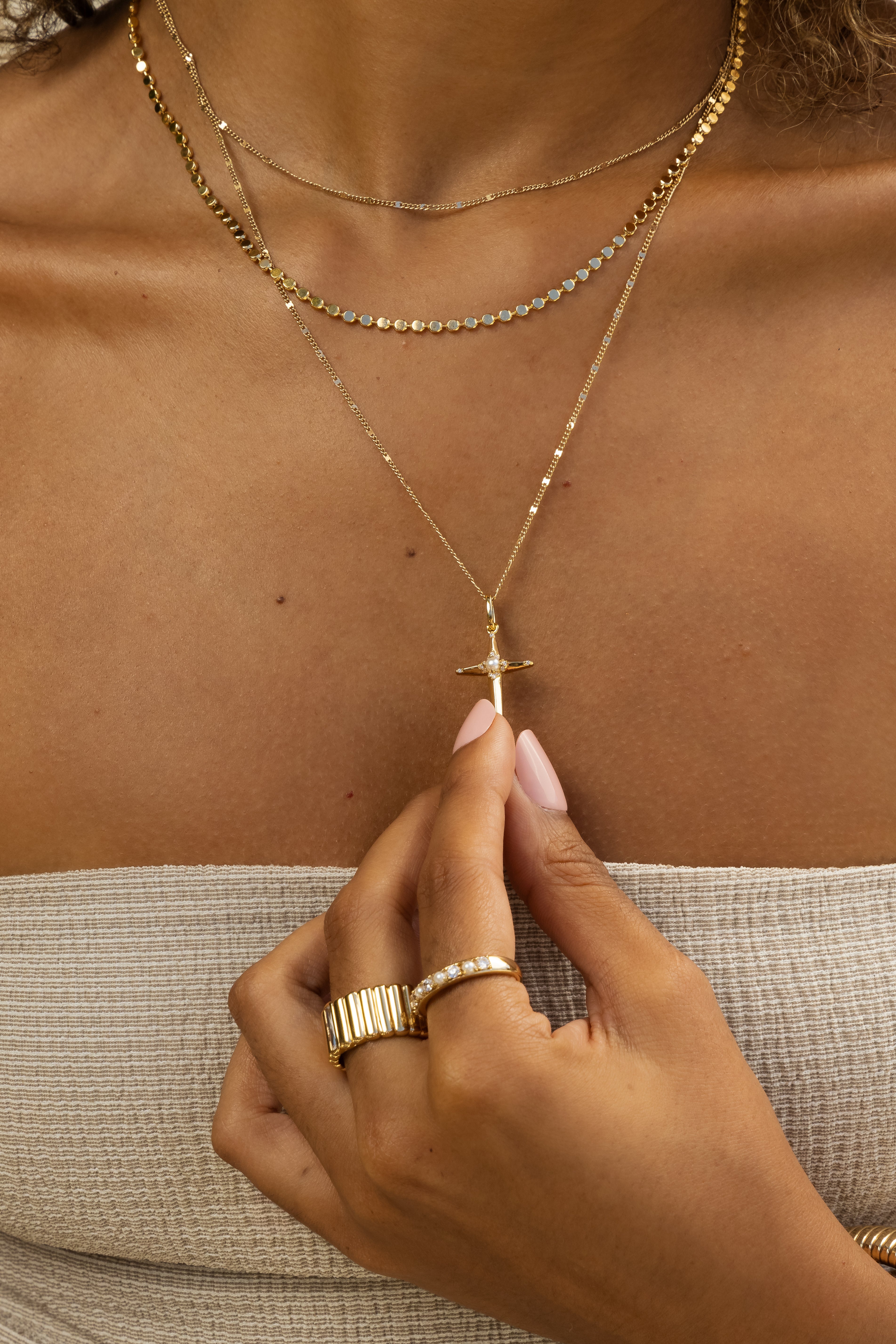 Close-up view of Paisley Gold Mirror Chain Necklace styled around a model's neck