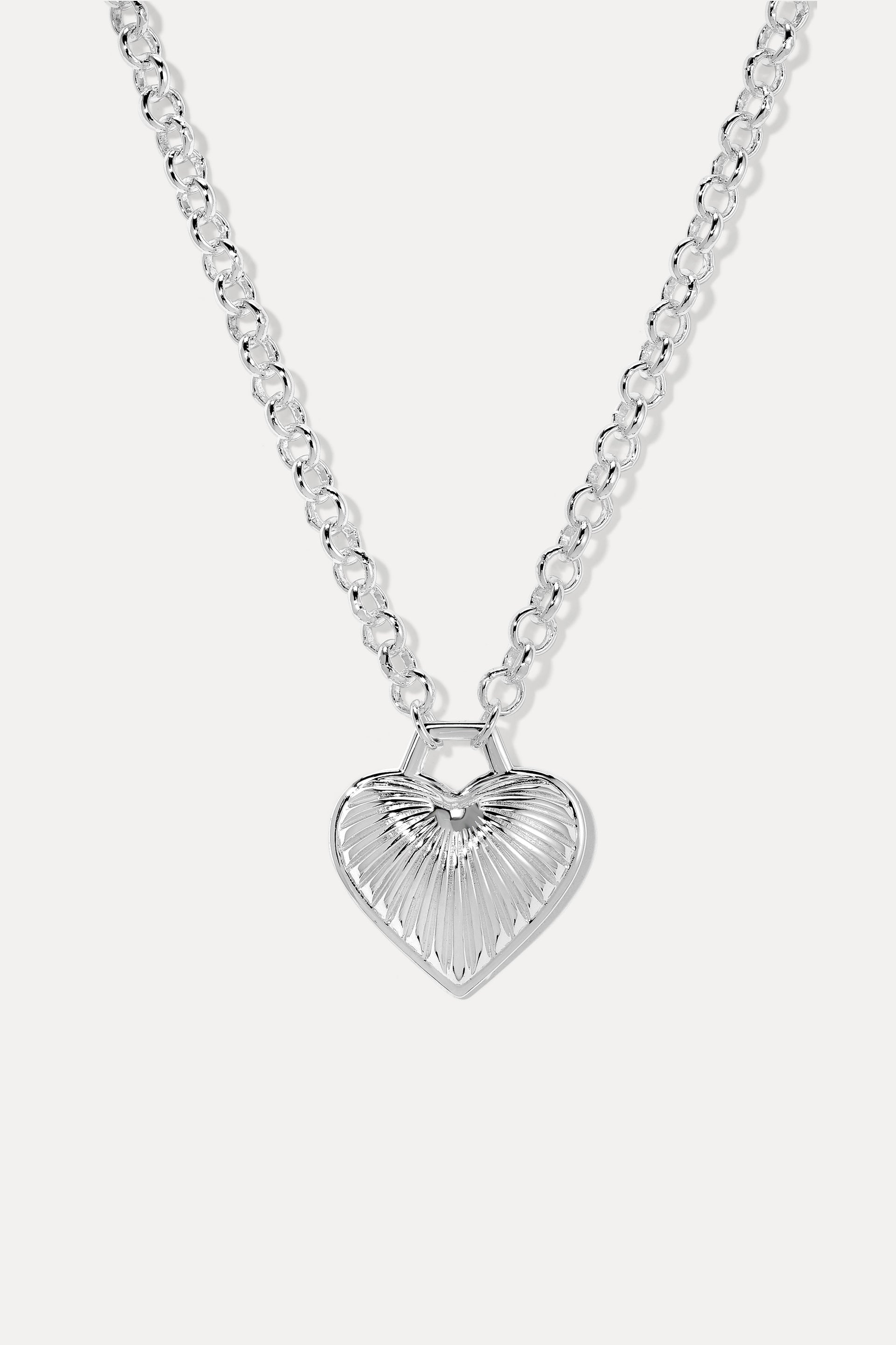 Juliet Silver necklace is a heart pendant with ribbed texture on a rolo chain, displayed on a white background.
