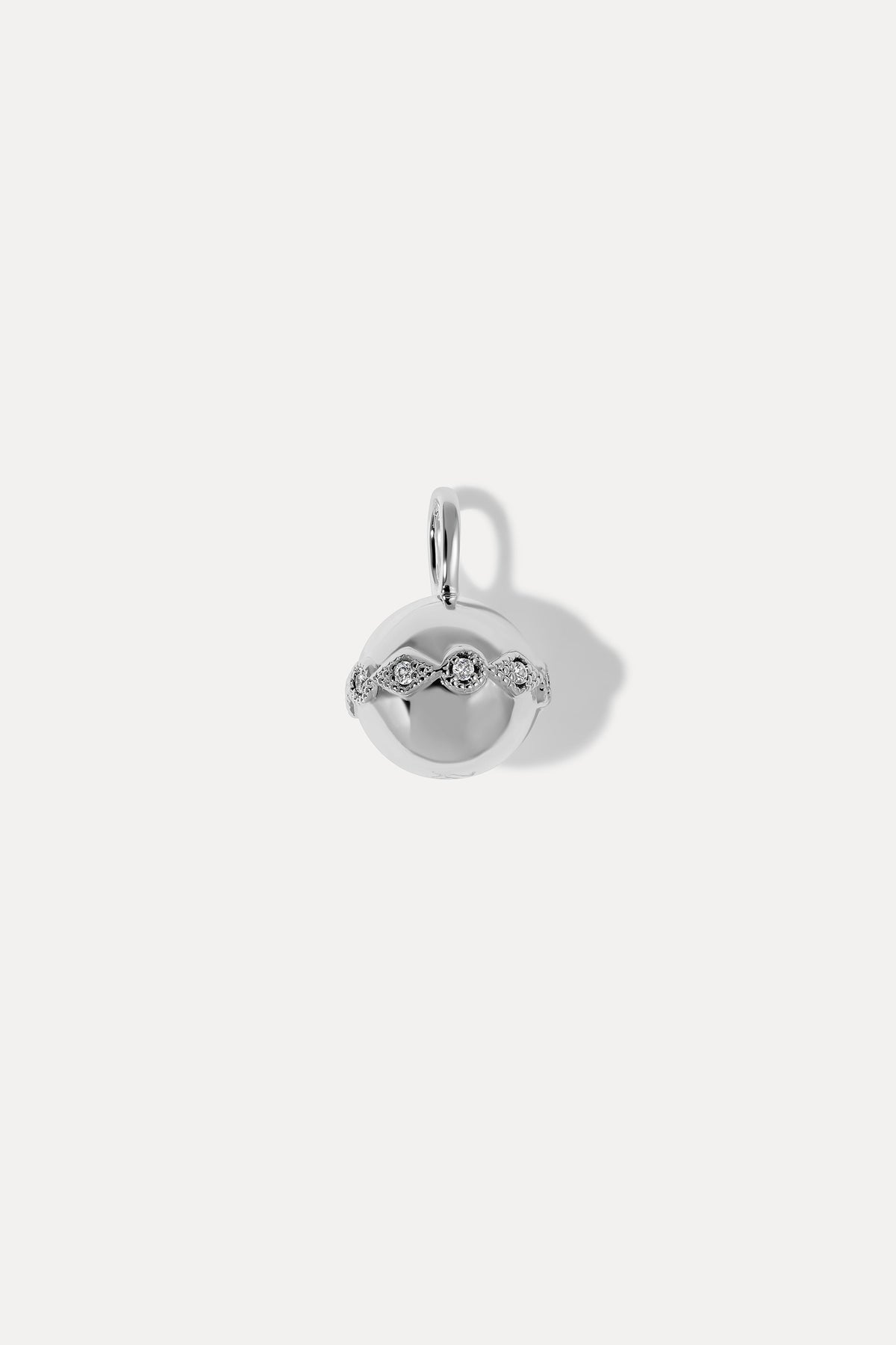 Silver circular Aurora Charm with a crisscross pattern set with round clear cubic zirconia stones on a white background.