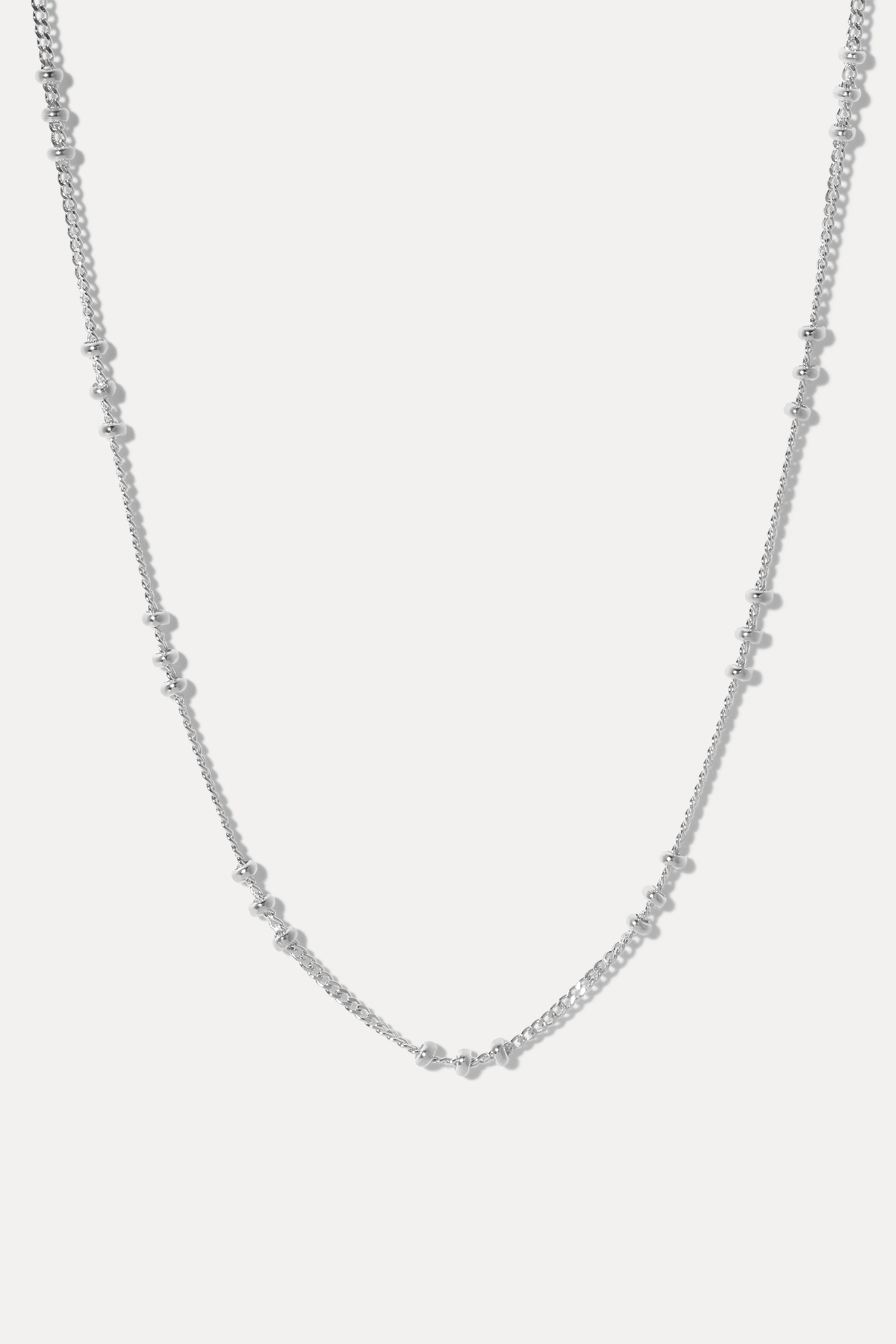 Silver Brinley satellite chain necklace displayed in a U-shape on a clean white background.