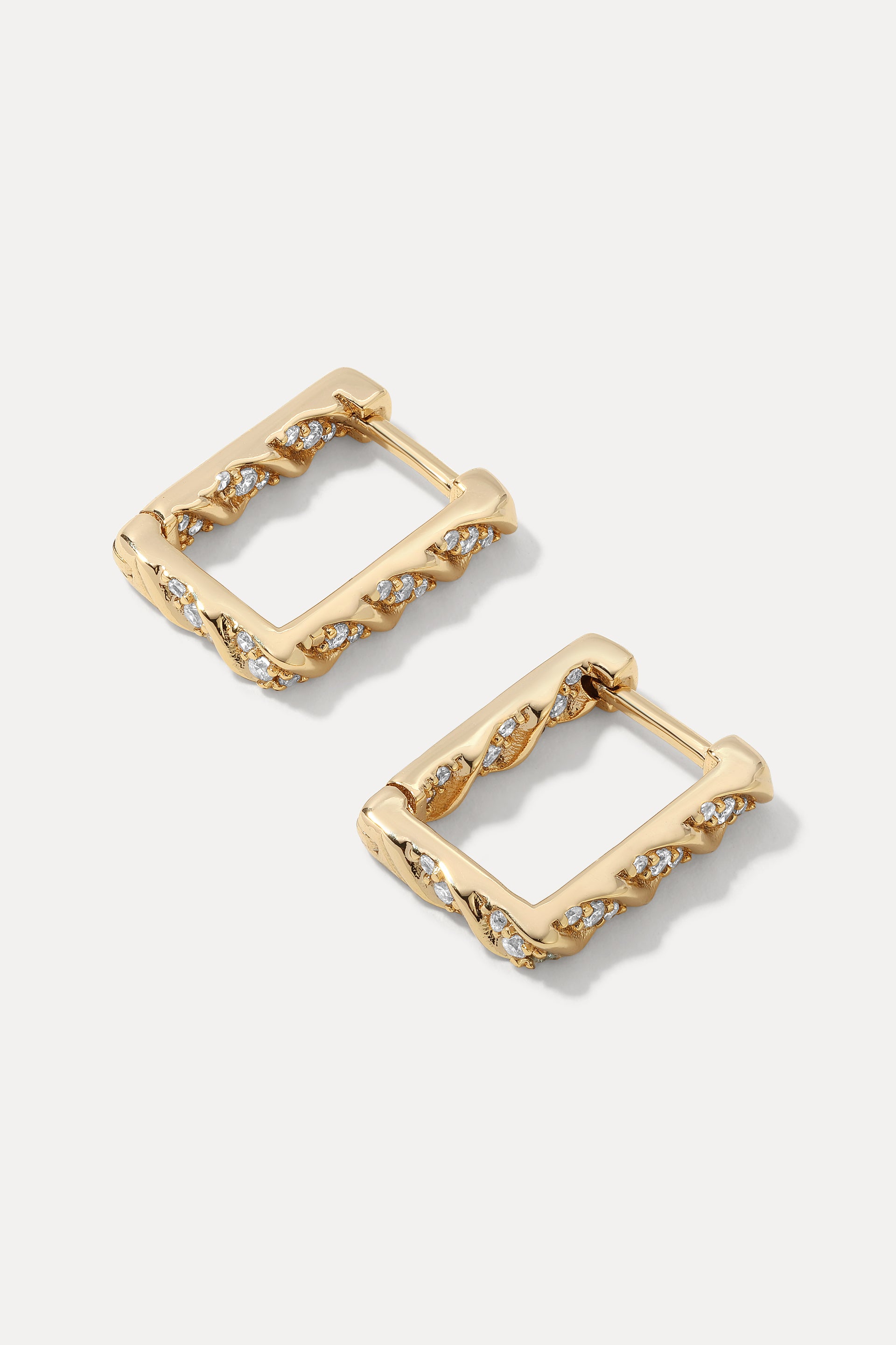 Pair of gold square-shaped Brynn Huggies with textured details and set cubic zirconias.
