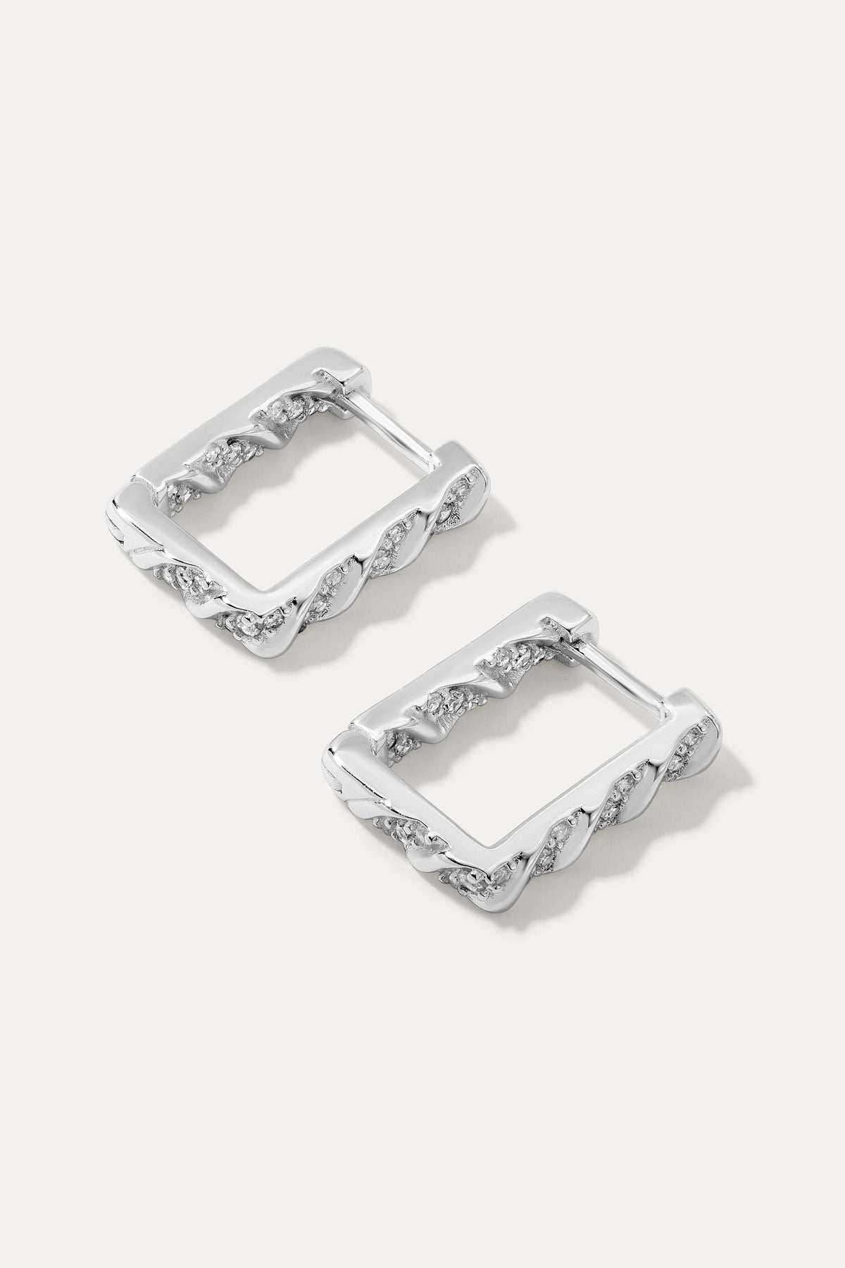 Pair of silver square-shaped Brynn Huggies with textured details and set cubic zirconias.
