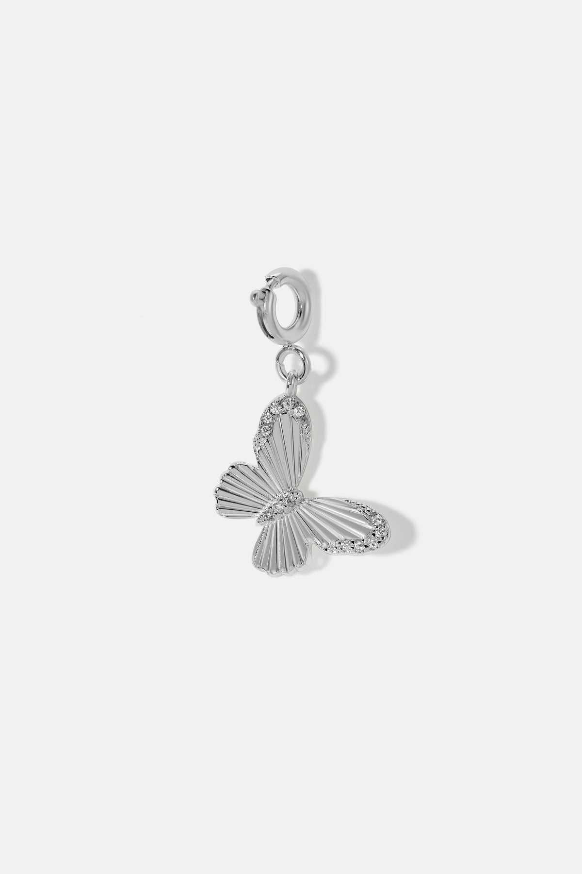 Silver Butterfly Clip On Charm featuring detailed textured wings and cubic zirconia accents on a white background.