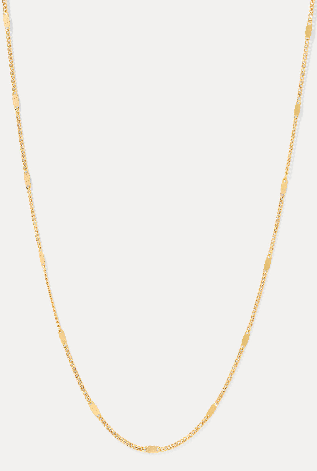 Gold Coco cable chain necklace with dapped bar links displayed in a U-shape on a clean white background.