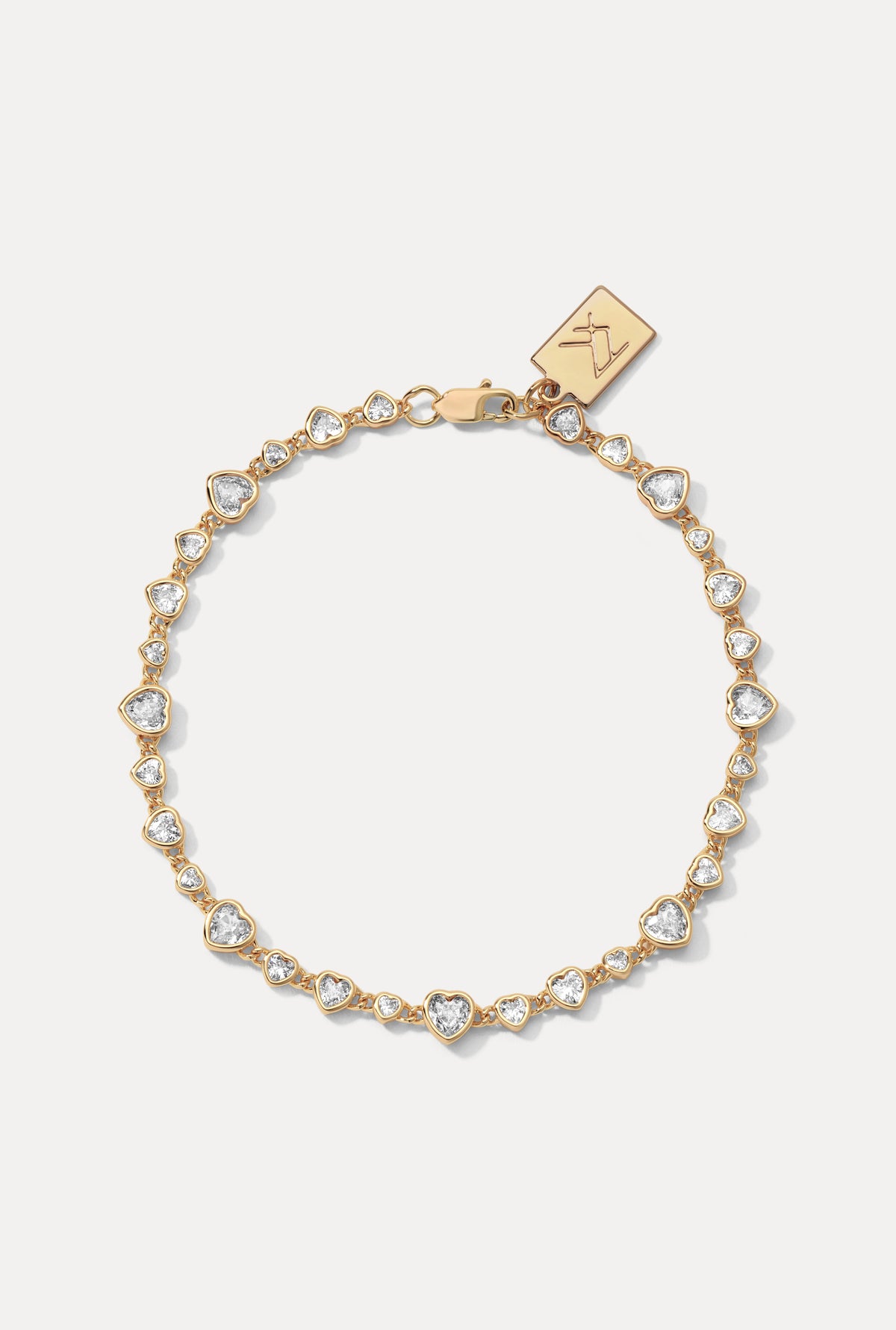 Gold Cora Bracelet displayed in a circle on a white background, showing its heart-shaped CZ settings.