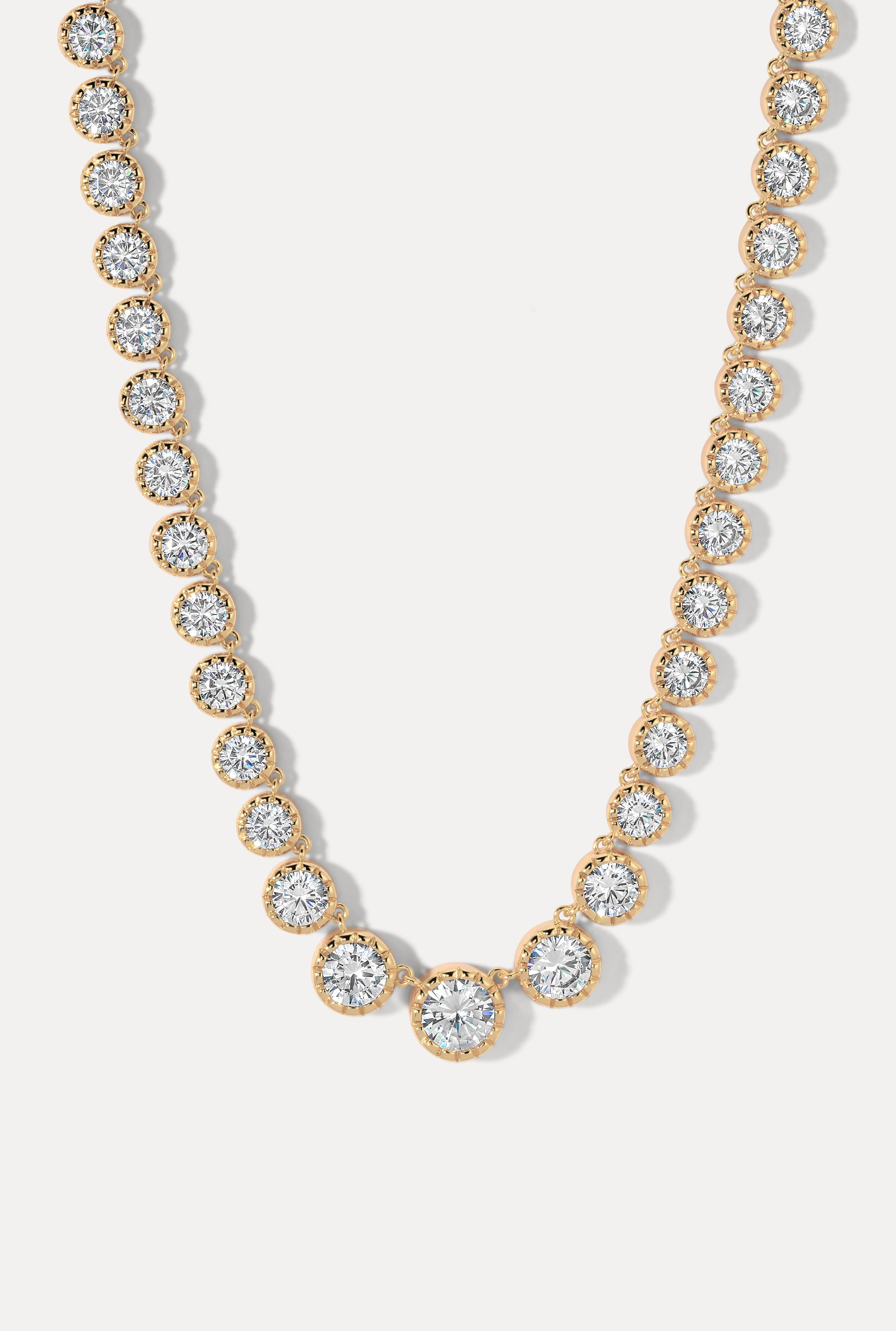 Esme Gold Necklace with graduated bezel-set CZ stones on a plain white background.
