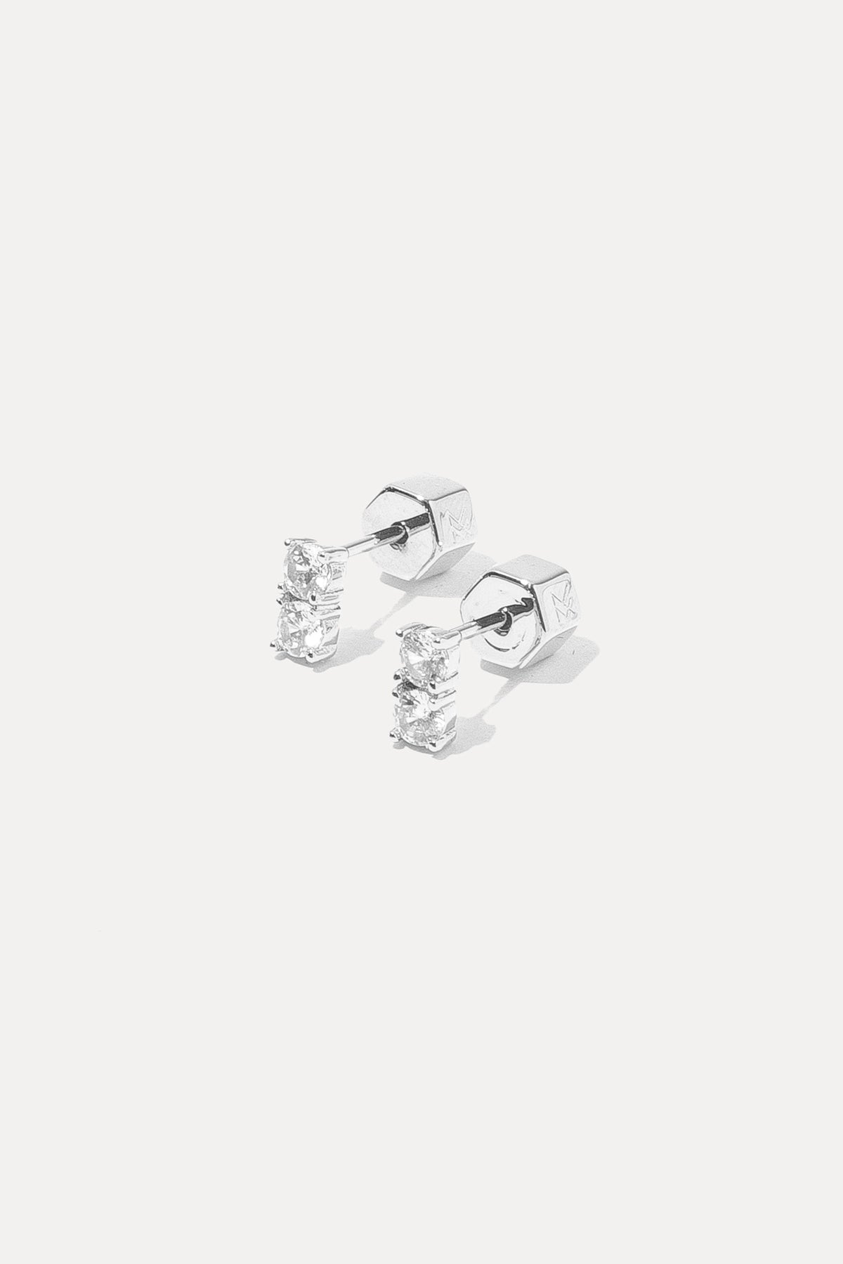 Pair of silver Gwen Studs with clear crystals displayed on a white background.