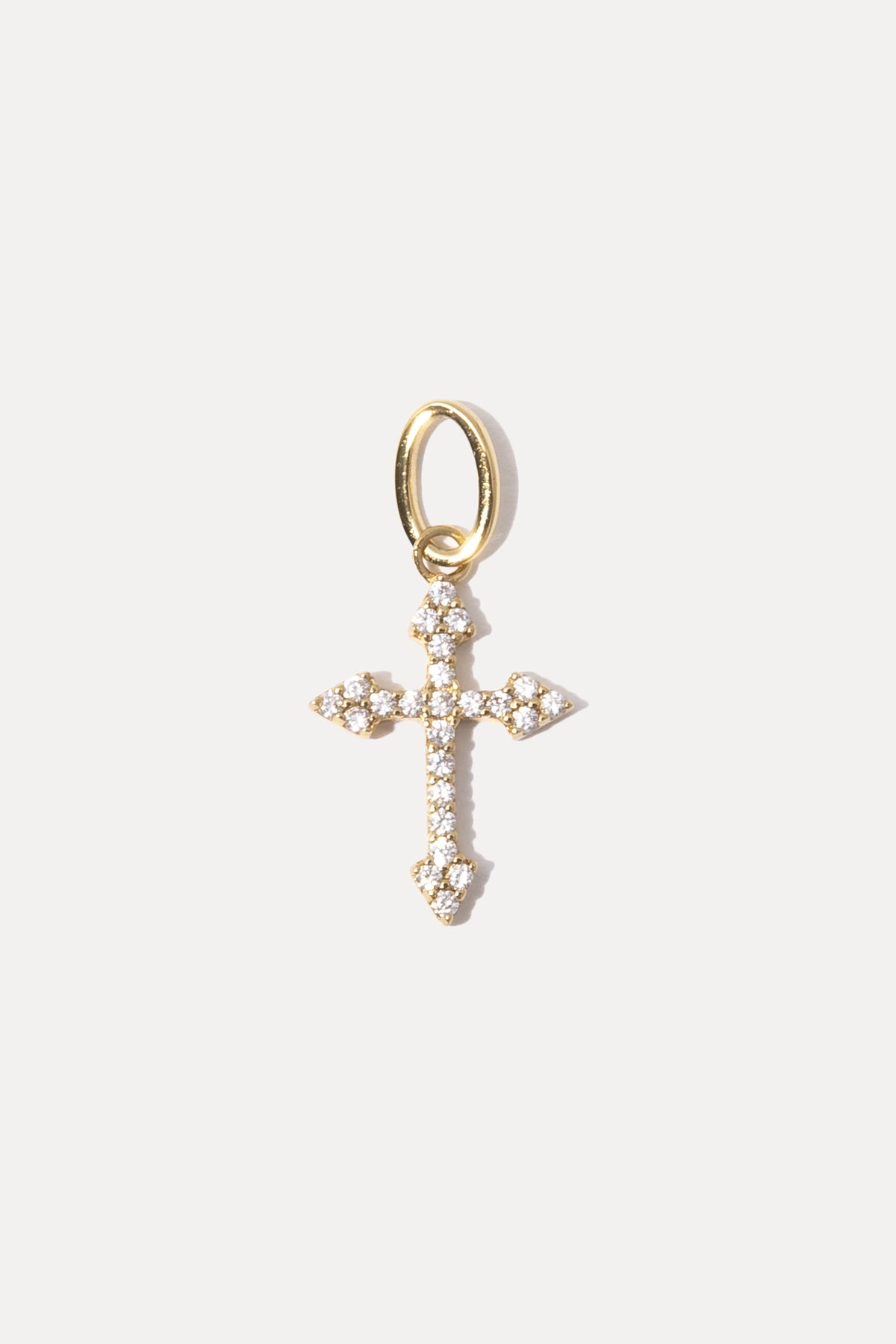Gold Harmony charm with pavé cubic zirconia on a white background.