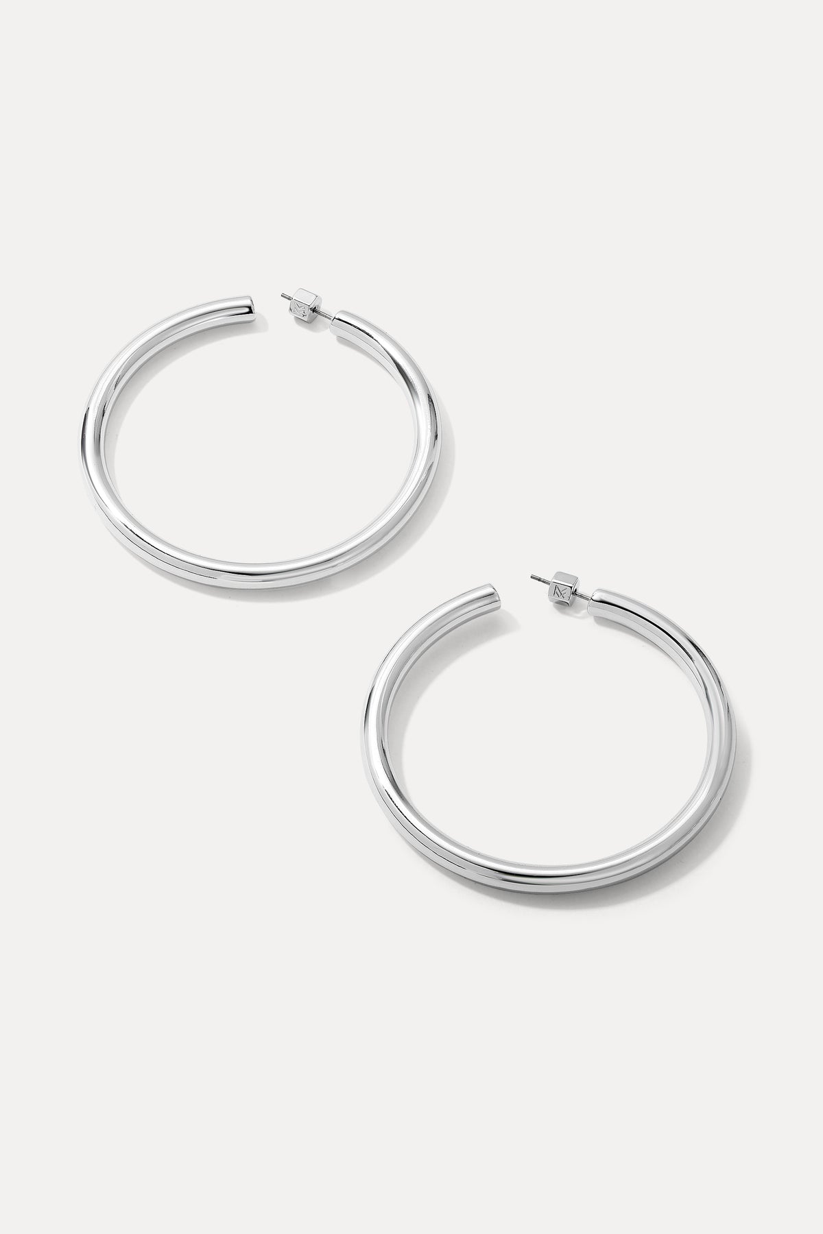 Pair of silver Harper Hoops displayed on a clean white background.