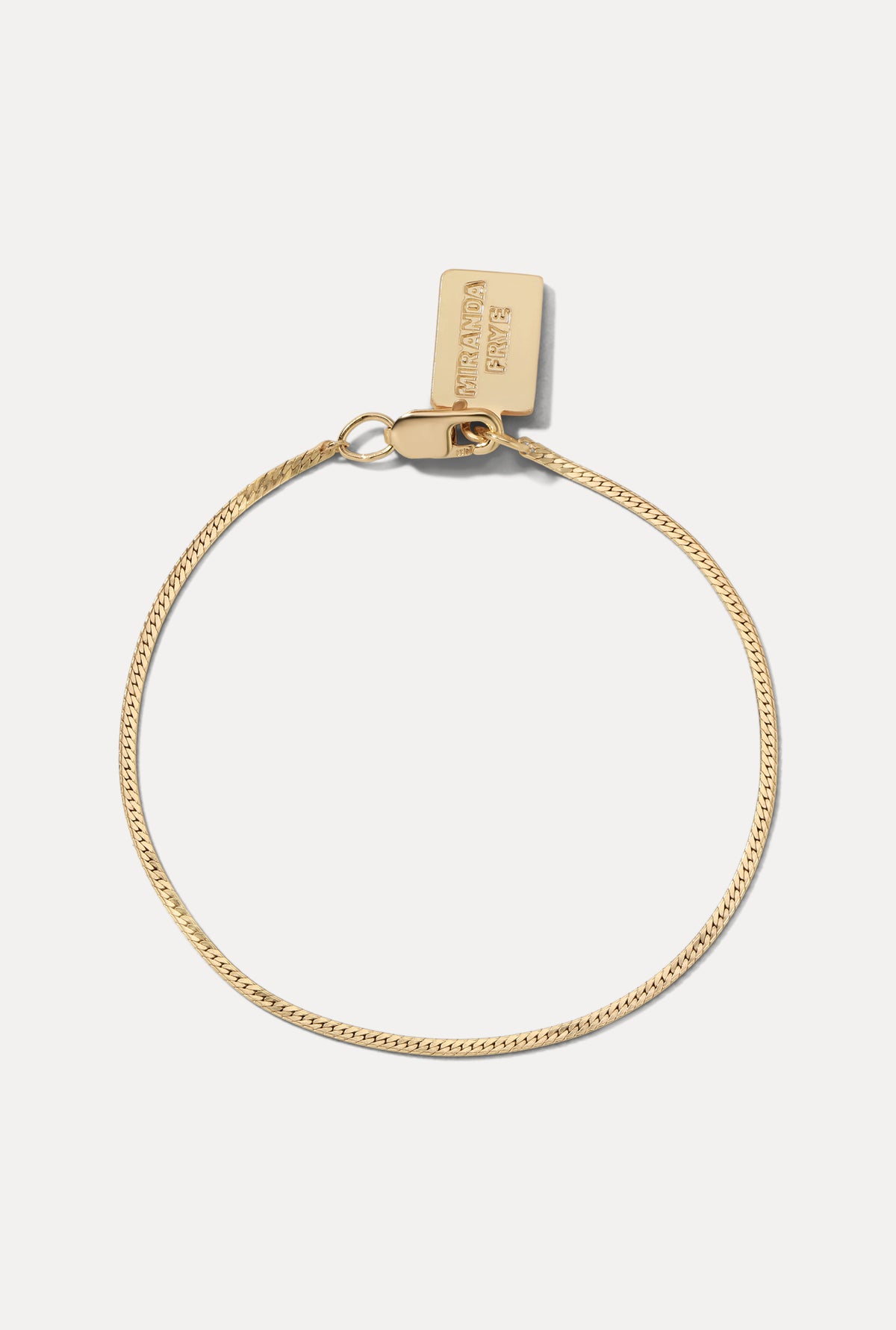 Gold-filled Josephine Bracelet displayed in a circle on a white background with clasp and logo tag.