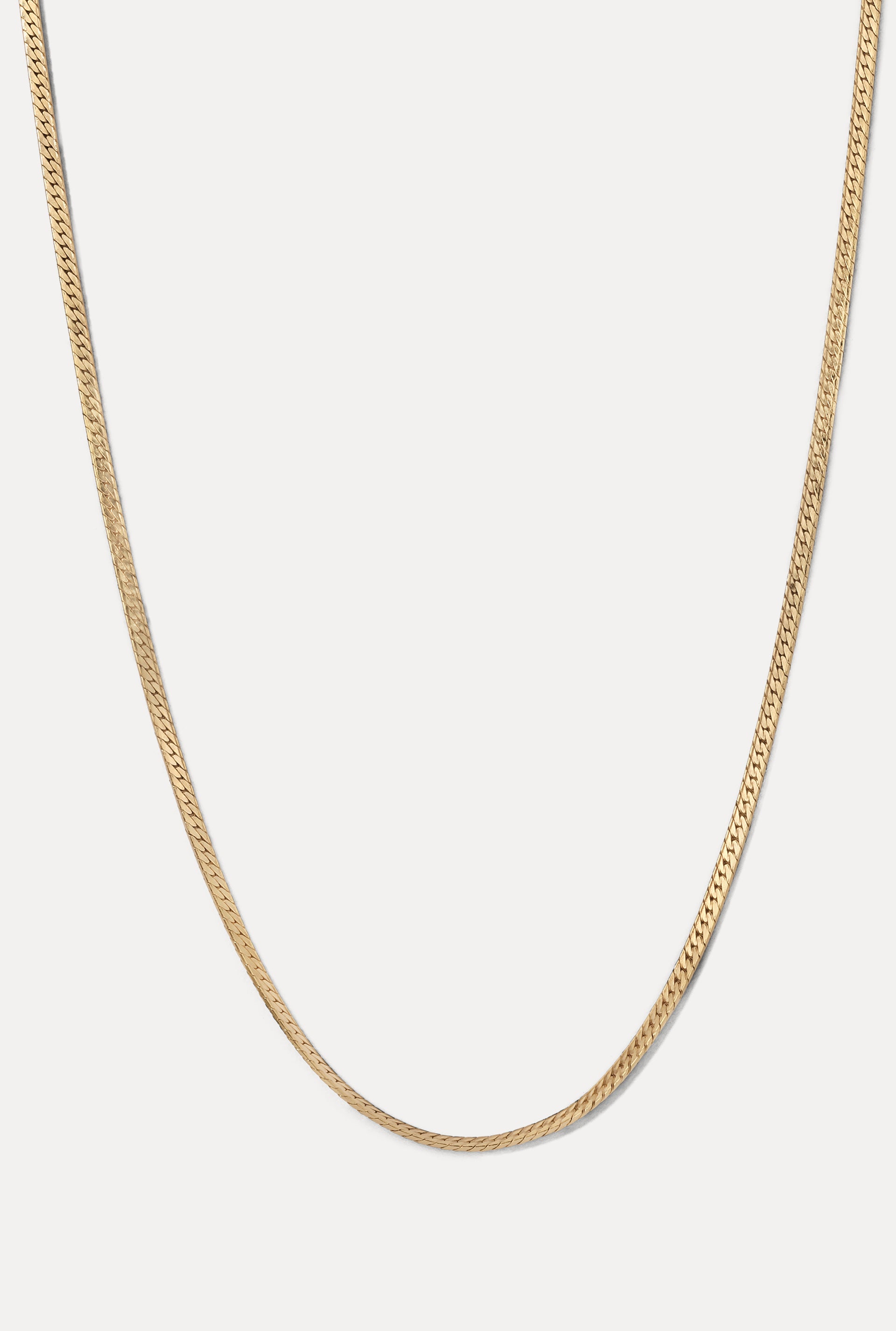 Gold Josephine Chain herringbone necklace displayed in a U-shape on a clean white background.