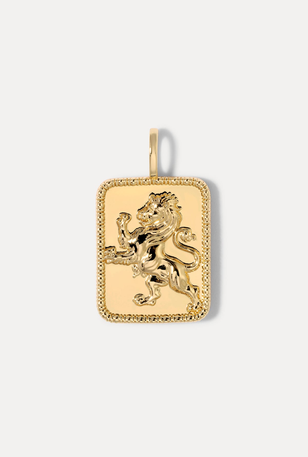 Rectangular gold lion pendant charm on a bail against a plain white background.