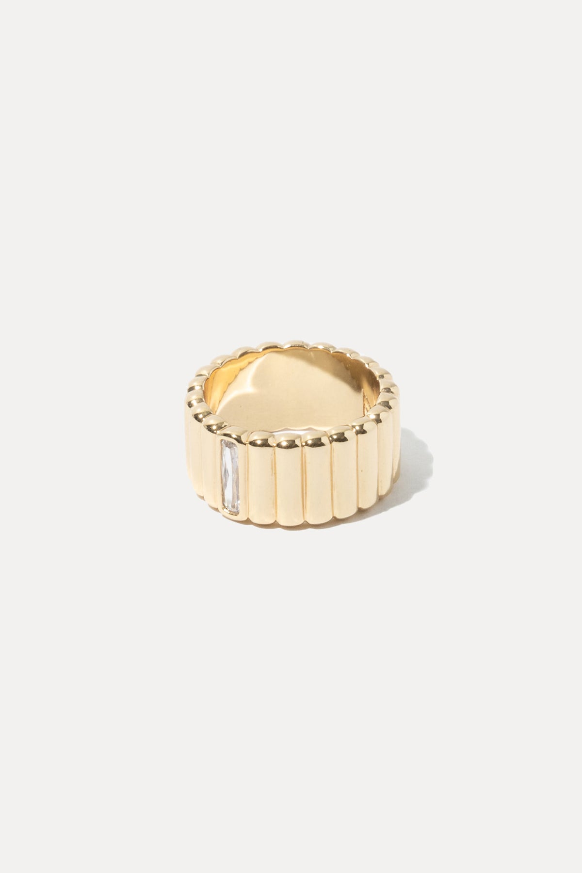 Gold Lisa ring featuring a delicate band and polished finish, centered on a plain white background.