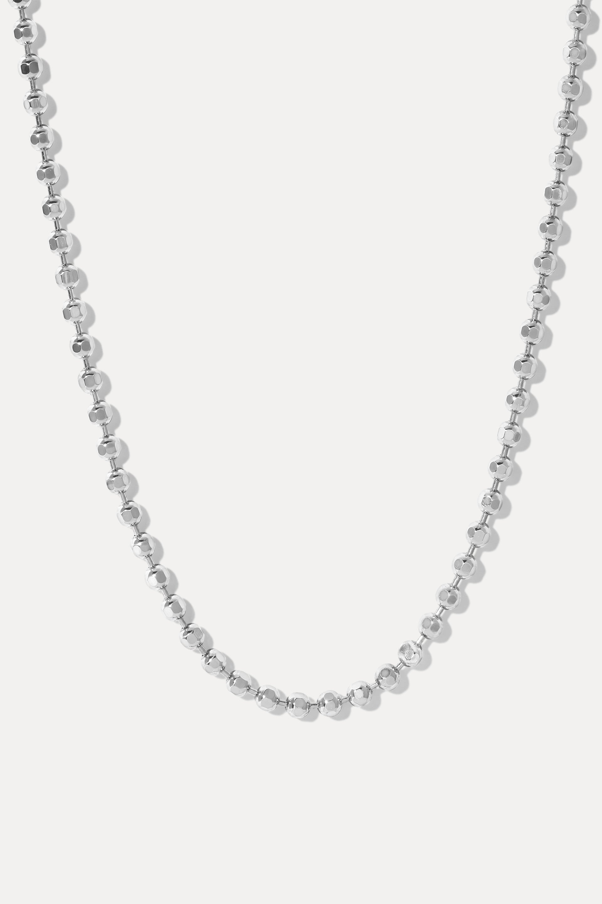 London ball chain necklace in silver with diamond-cut beads, displayed on a white background.