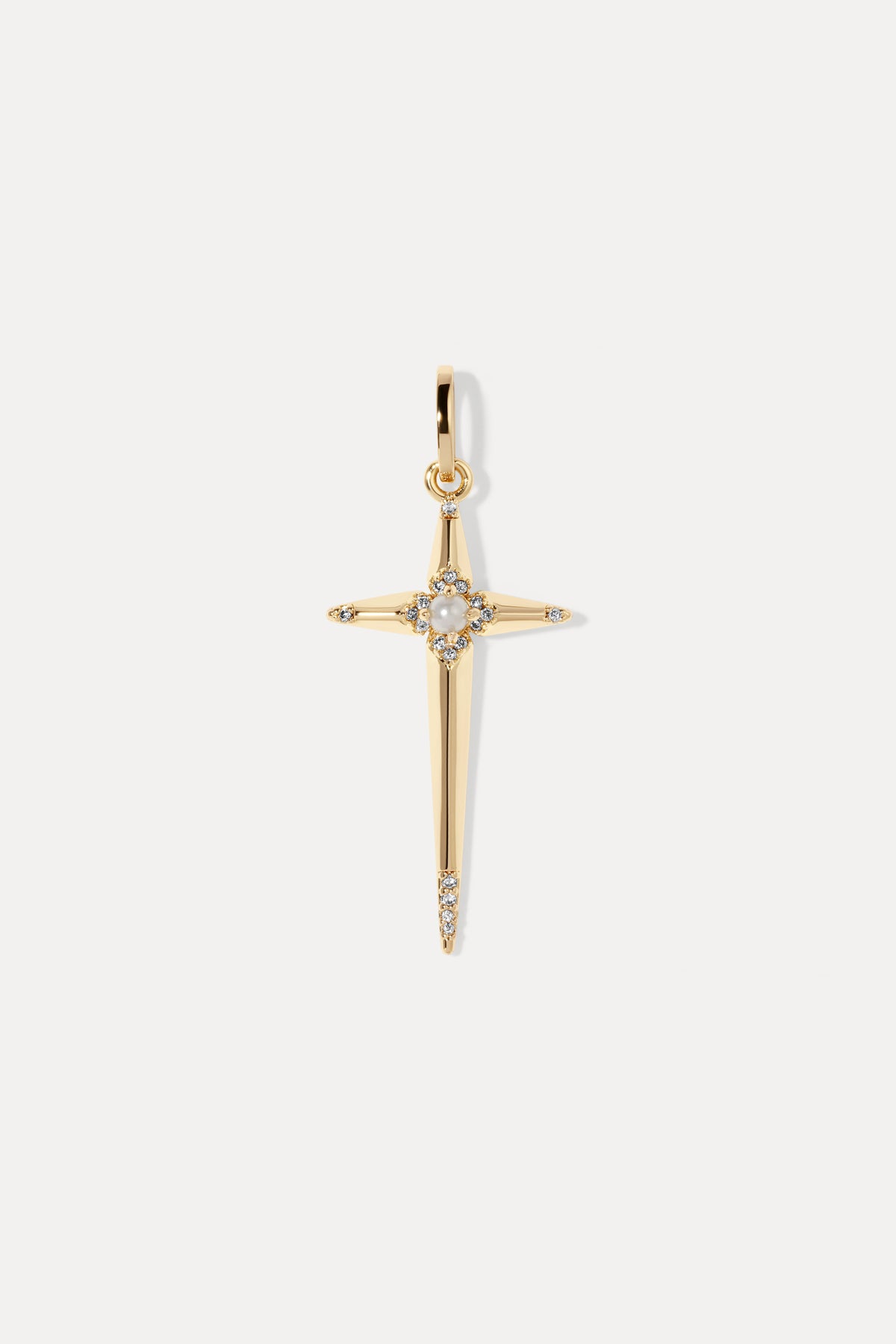 Gold cross charm set with a center pearl and cubic zirconia accents on a bail.