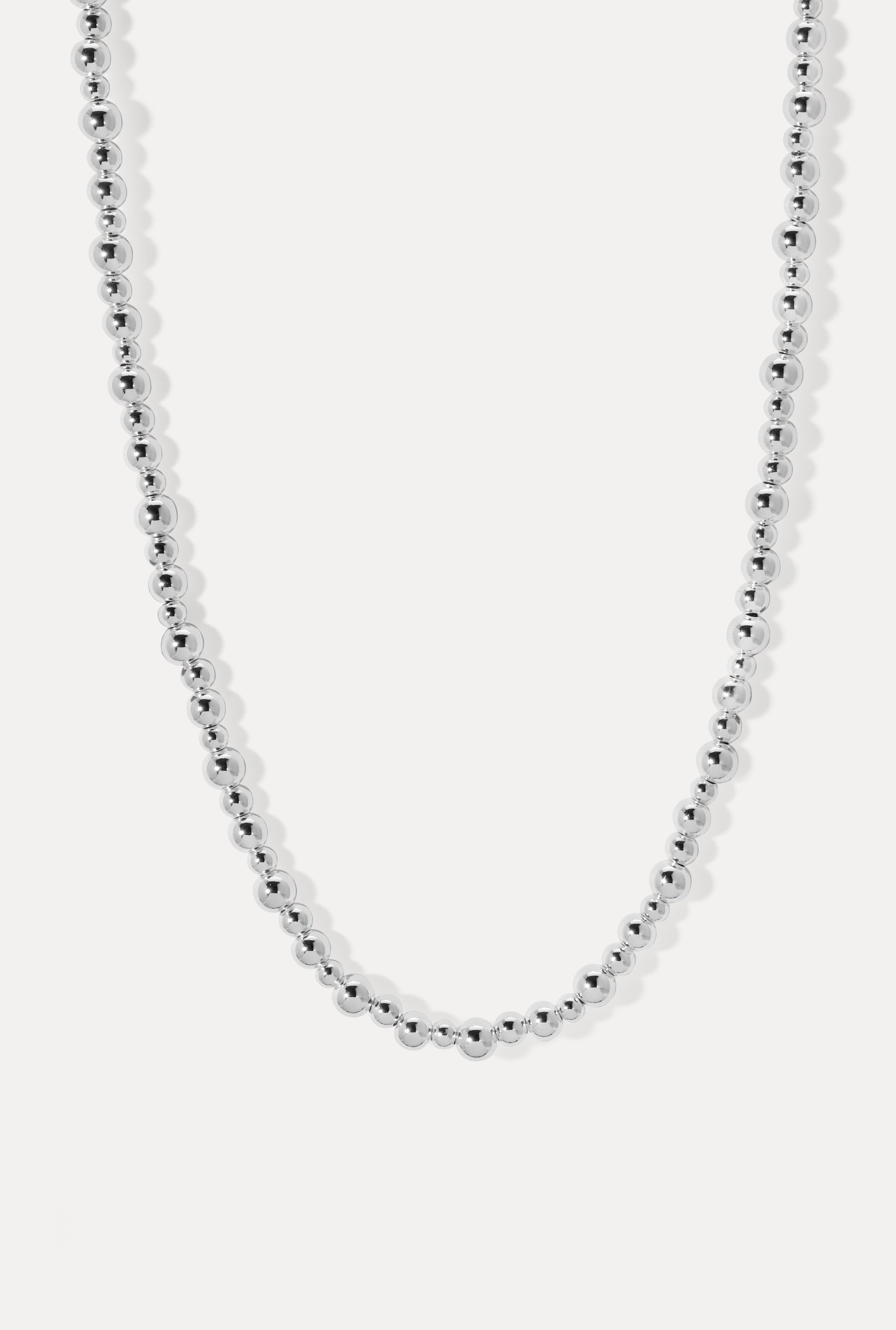 Silver Marina necklace with graduated ball chain beads, displayed on a clean white background.
