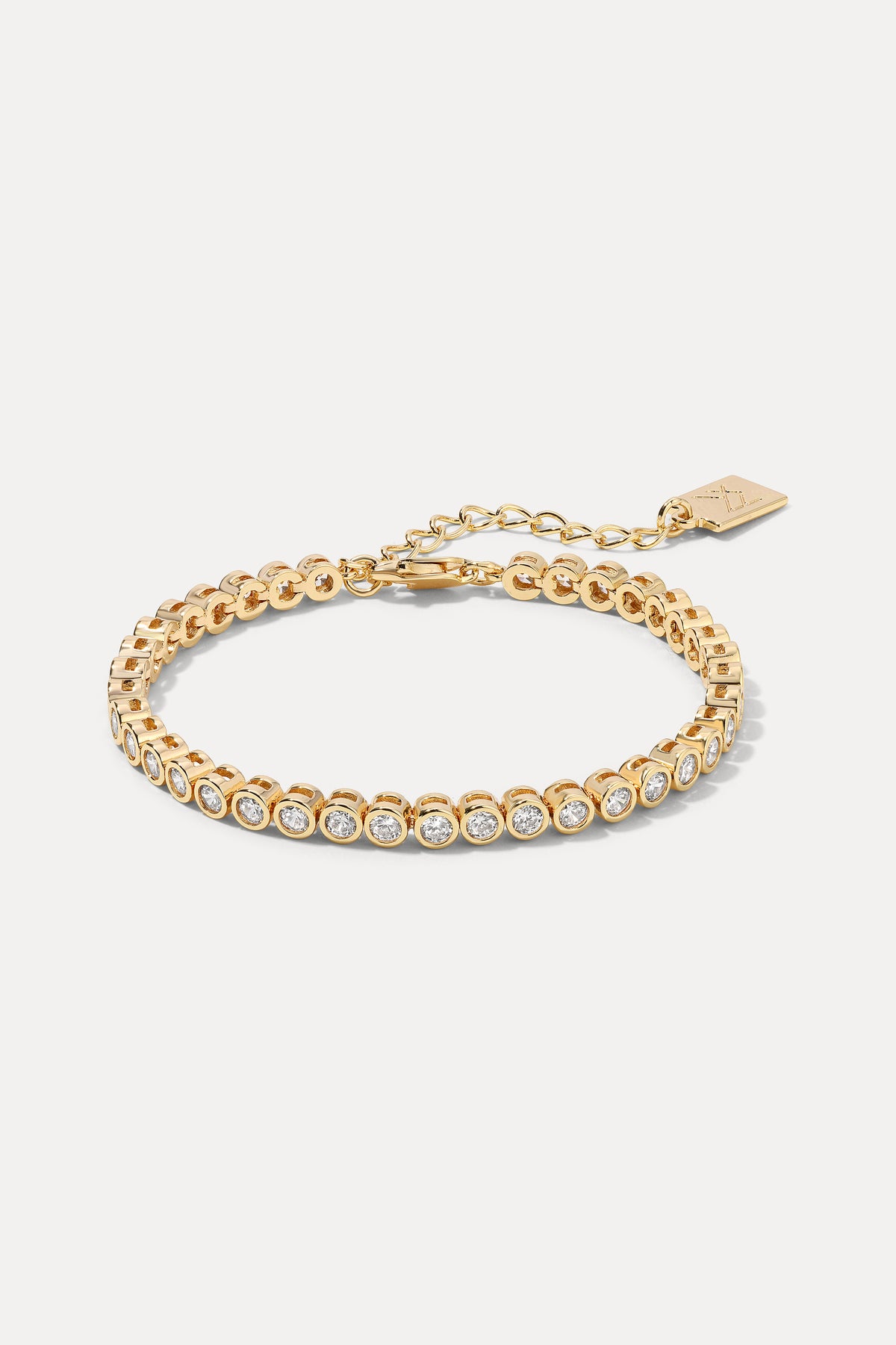 Gold Meggan classic tennis bracelet with round sparkling cubic zirconia displayed on a white background.