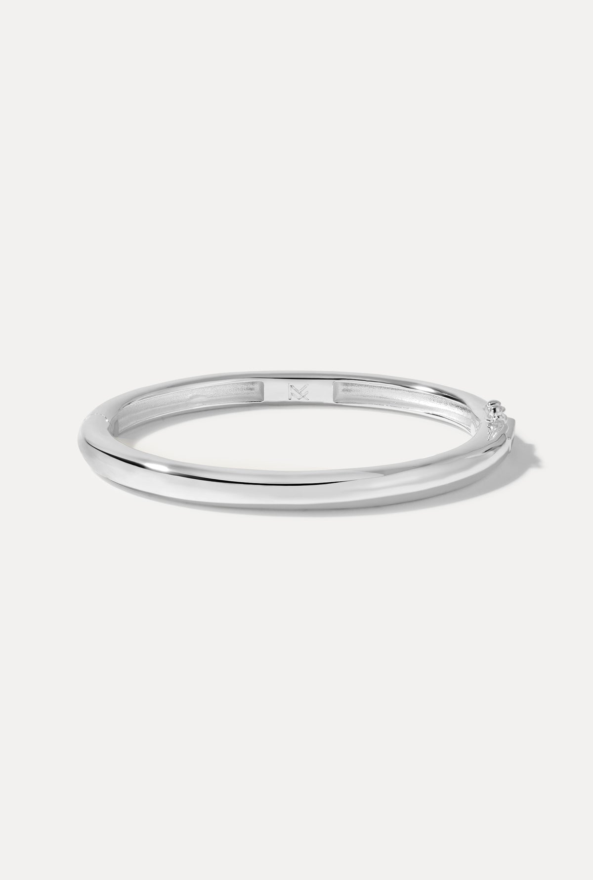 Silver-plated Mina Cuff displayed in an oval shape on a plain white background.