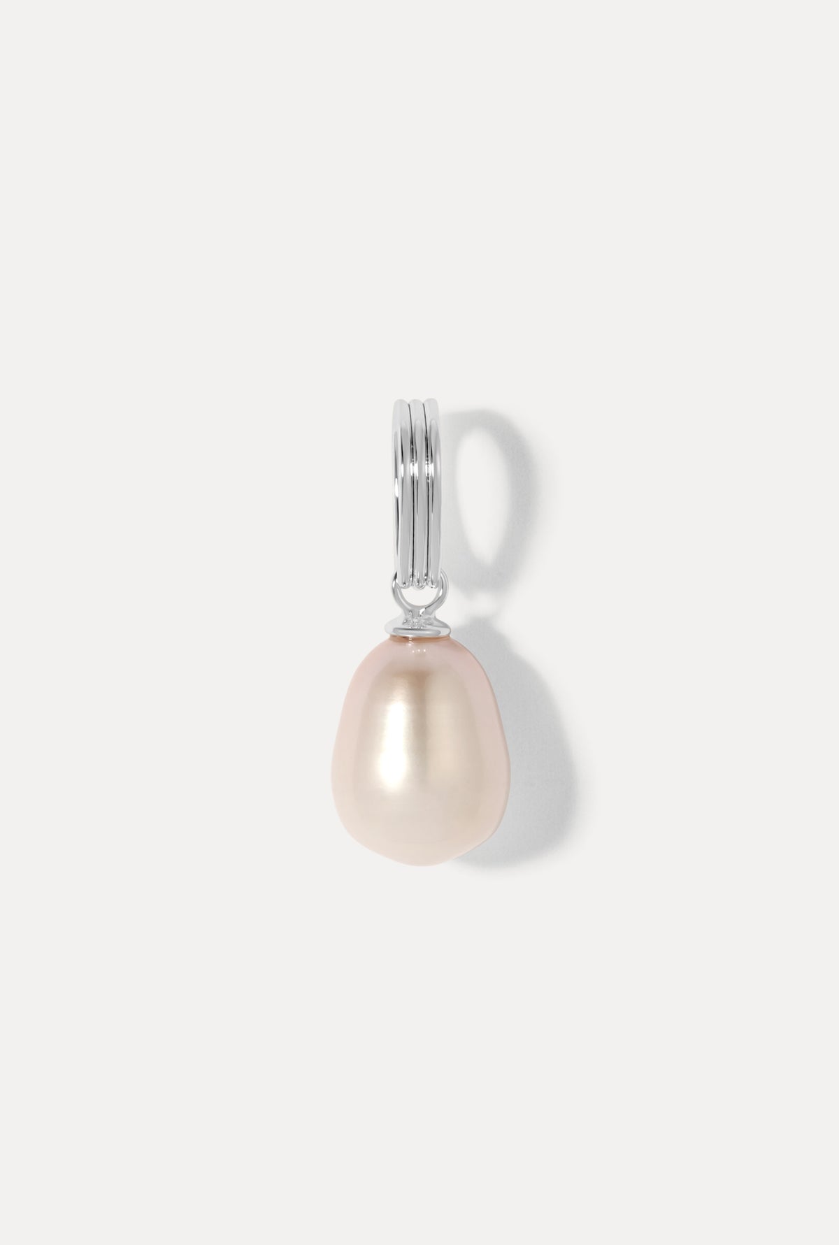 Teardrop pearl charm on a silver bail against a plain white background.