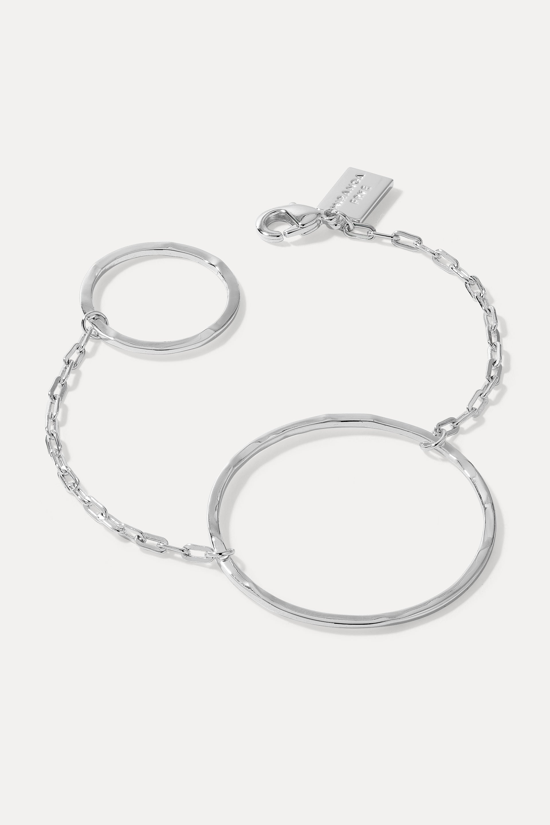 Silver Quinn circle link bracelet with clasp and logo tag displayed on a plain white background.