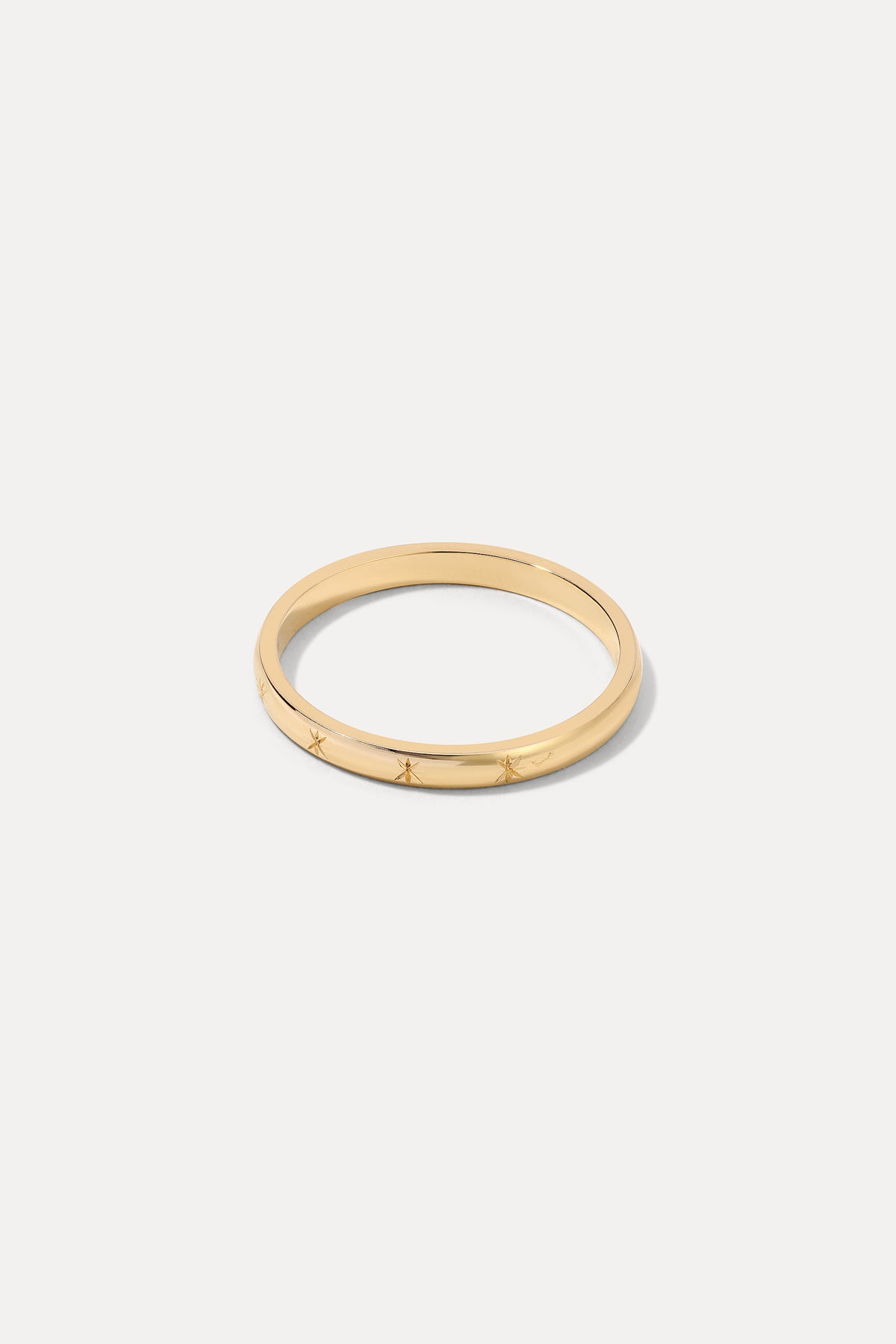 14K gold starburst signet-style band ring displayed against a plain white background.