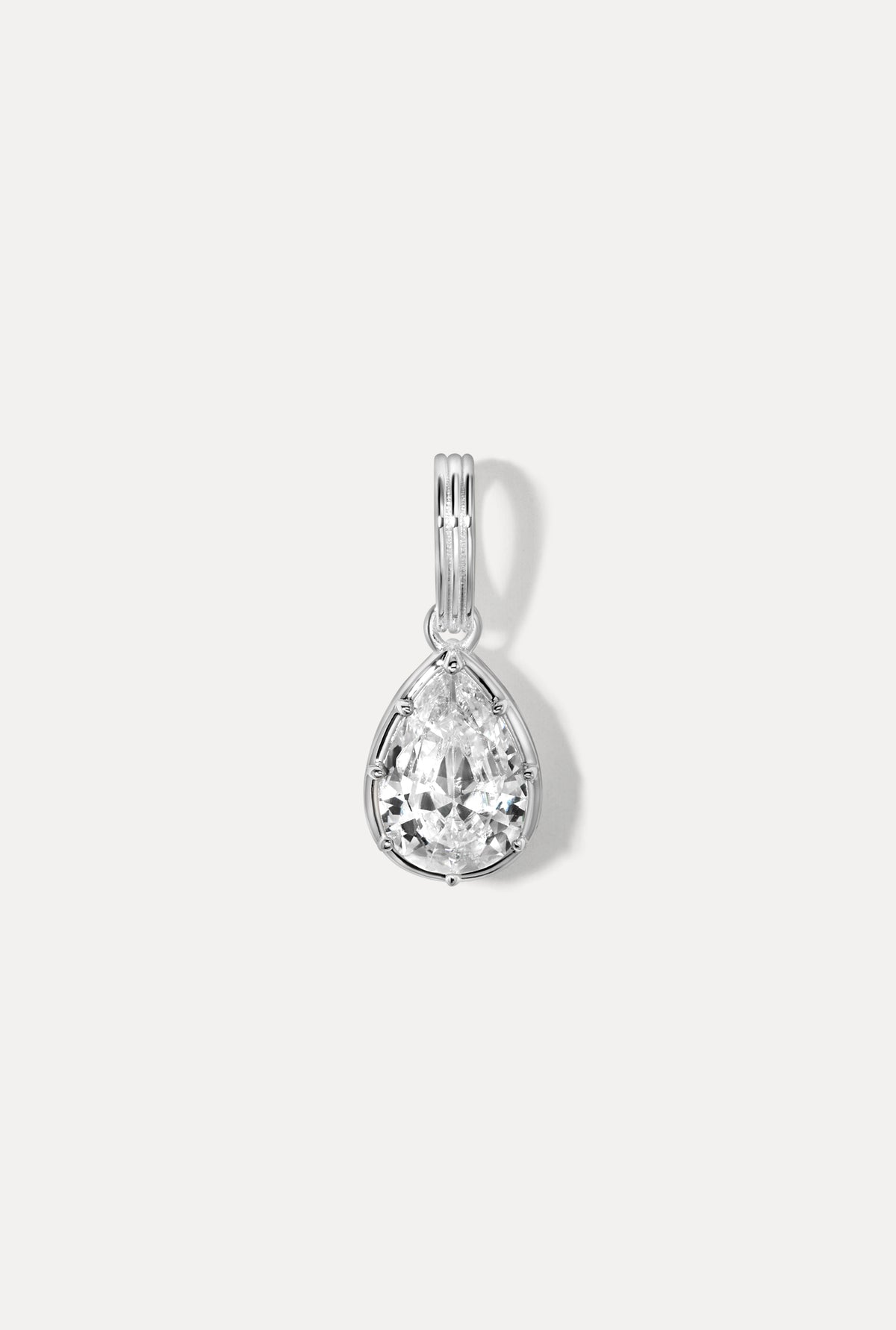 Silver smooth teardrop charm on a ring bail shown against a plain white background.