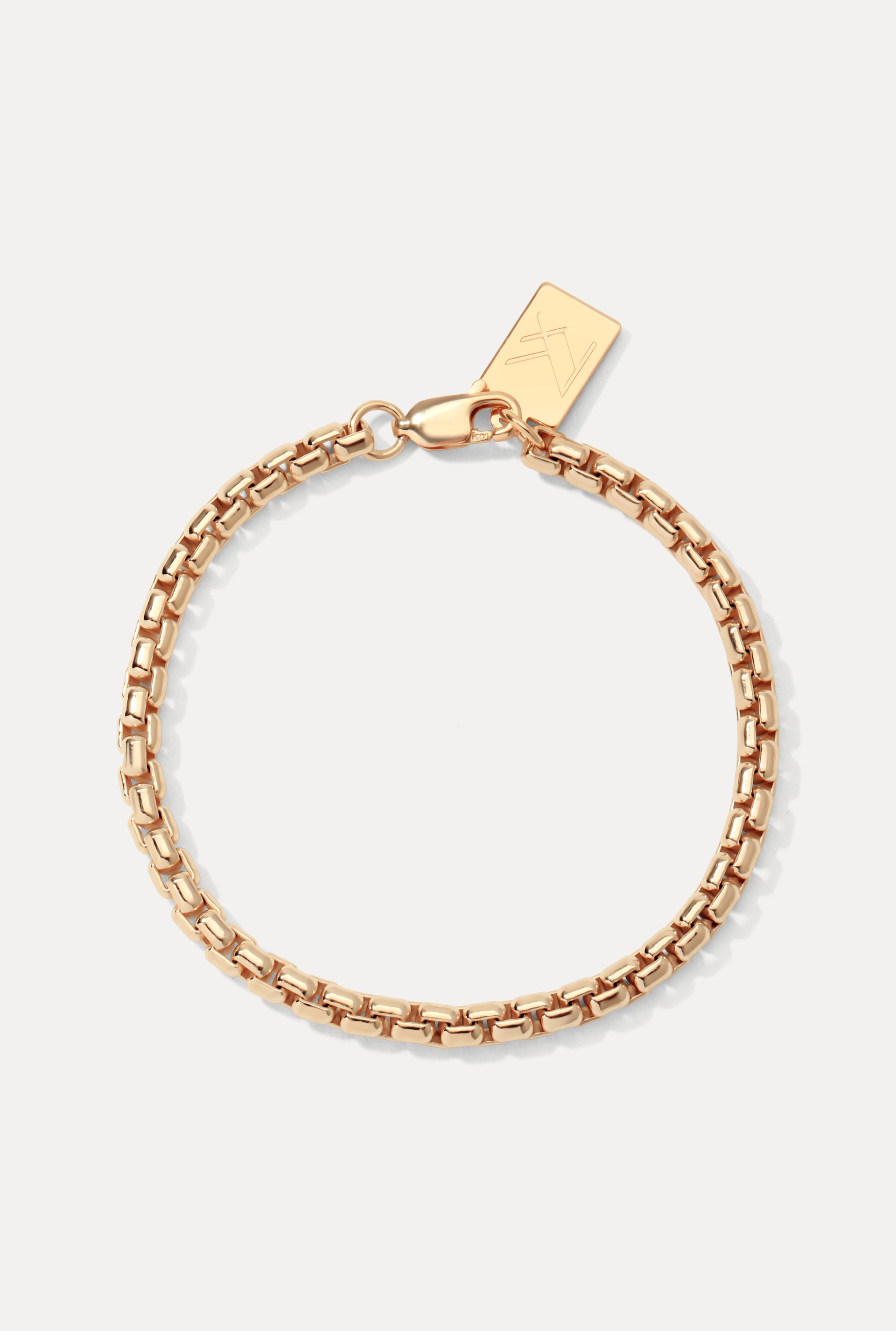 Gold-filled Wellon rounded box chain bracelet displayed in a circle on a plain white background with logo tag.